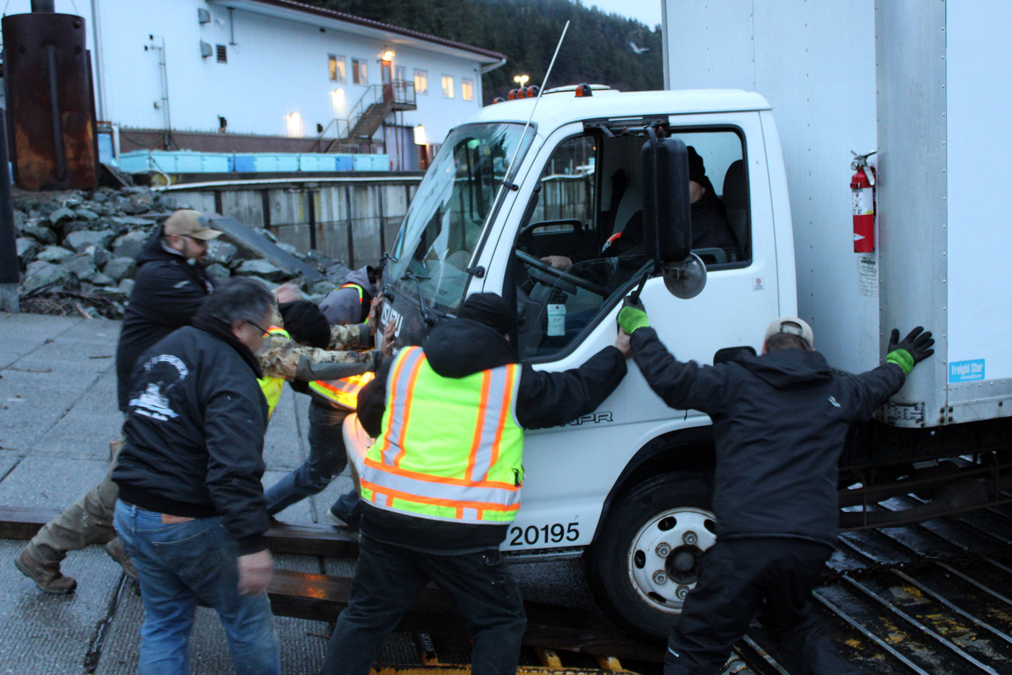 Personnel from the Central Council Tlingit and Haida Indian Tribes of Alaska load a box truck aboard the vessel Frontrunner for transit to Haines to provide relief and assistance in recovery efforts in Haines following catastrophic rainfall-fueled landslides, Dec. 3, 2020. (Ben Hohenstatt / Juneau Empire)