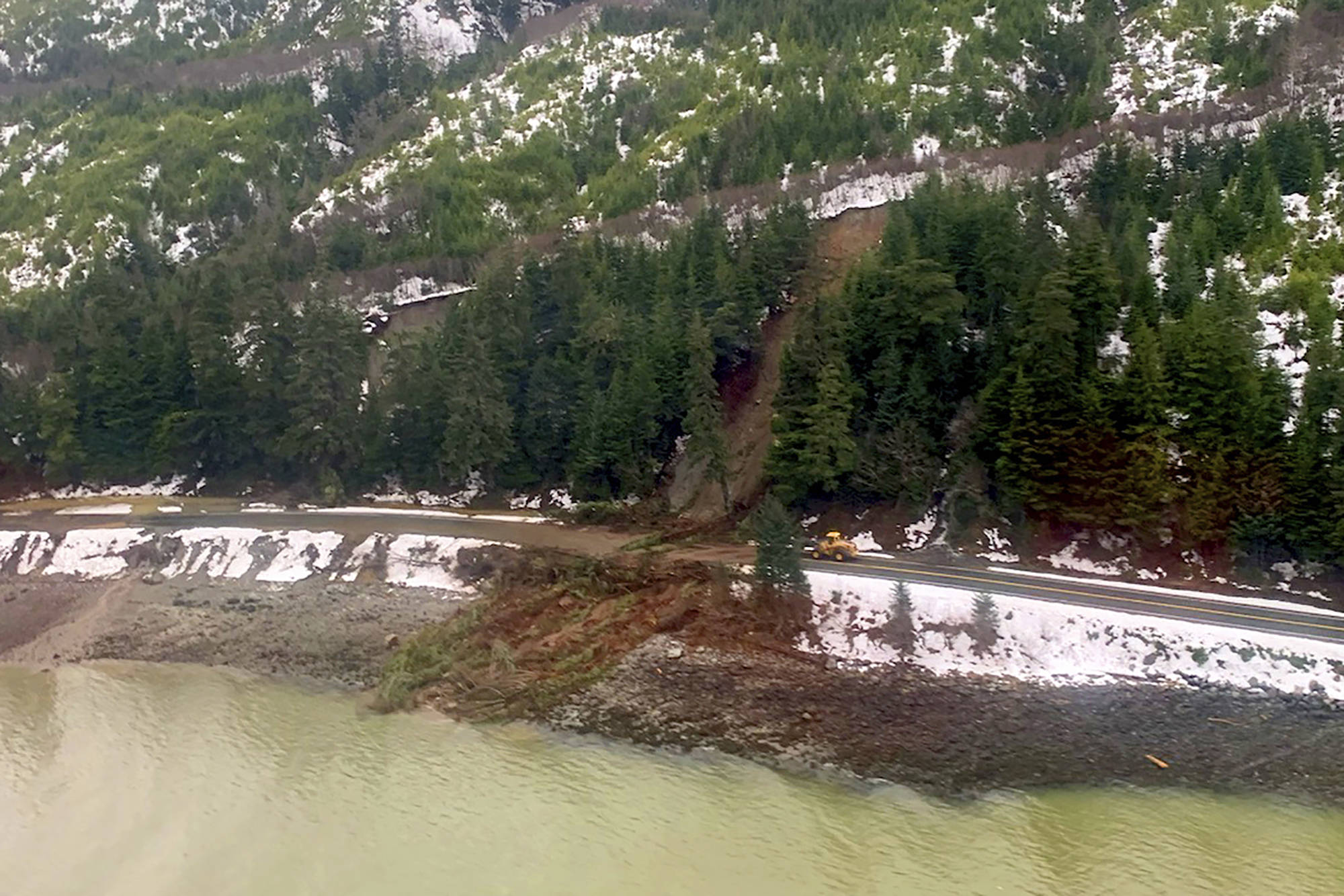 This photo from the U.S. Coast Guard shows where a rainstorm caused landslides in Haines, Alaska, Thursday, Dec. 3, 2020. Authorities have identified the two people missing after a landslide the width of two football fields slammed into the southeast Alaska community. The Coast Guard remains engaged with the Alaska State Troopers and the city of Haines while responding to this event. (Lt. Erick Oredson / U.S. Coast Guard)