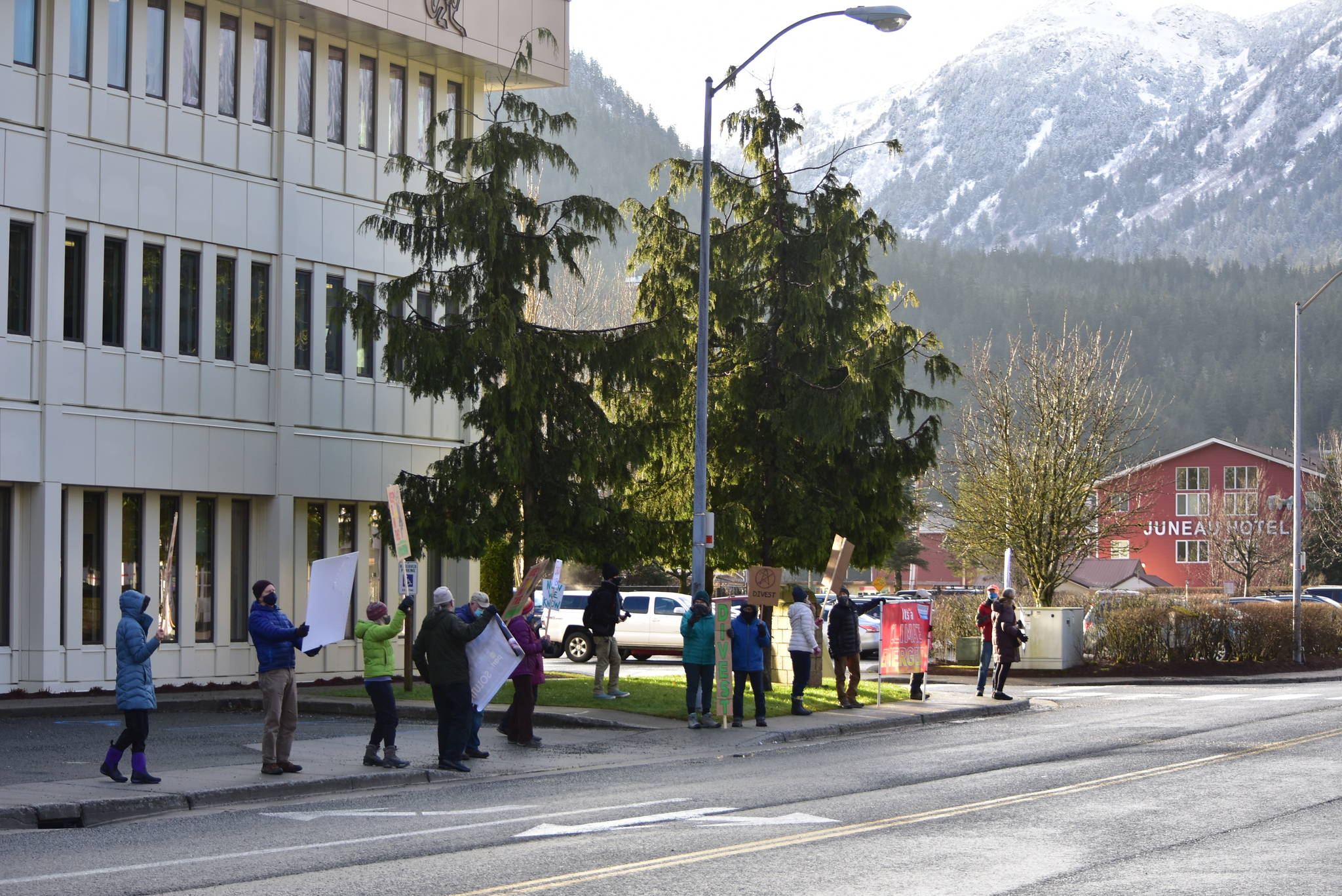 Environmentalists demonstrated in front of the Alaska Permanent Fund Corporation Wednesday, Dec. 9, 2020 calling on the Board of Trustees to divest the state’s wealth fund from fossil fuels. (Peter Segall / Juneau Empire)