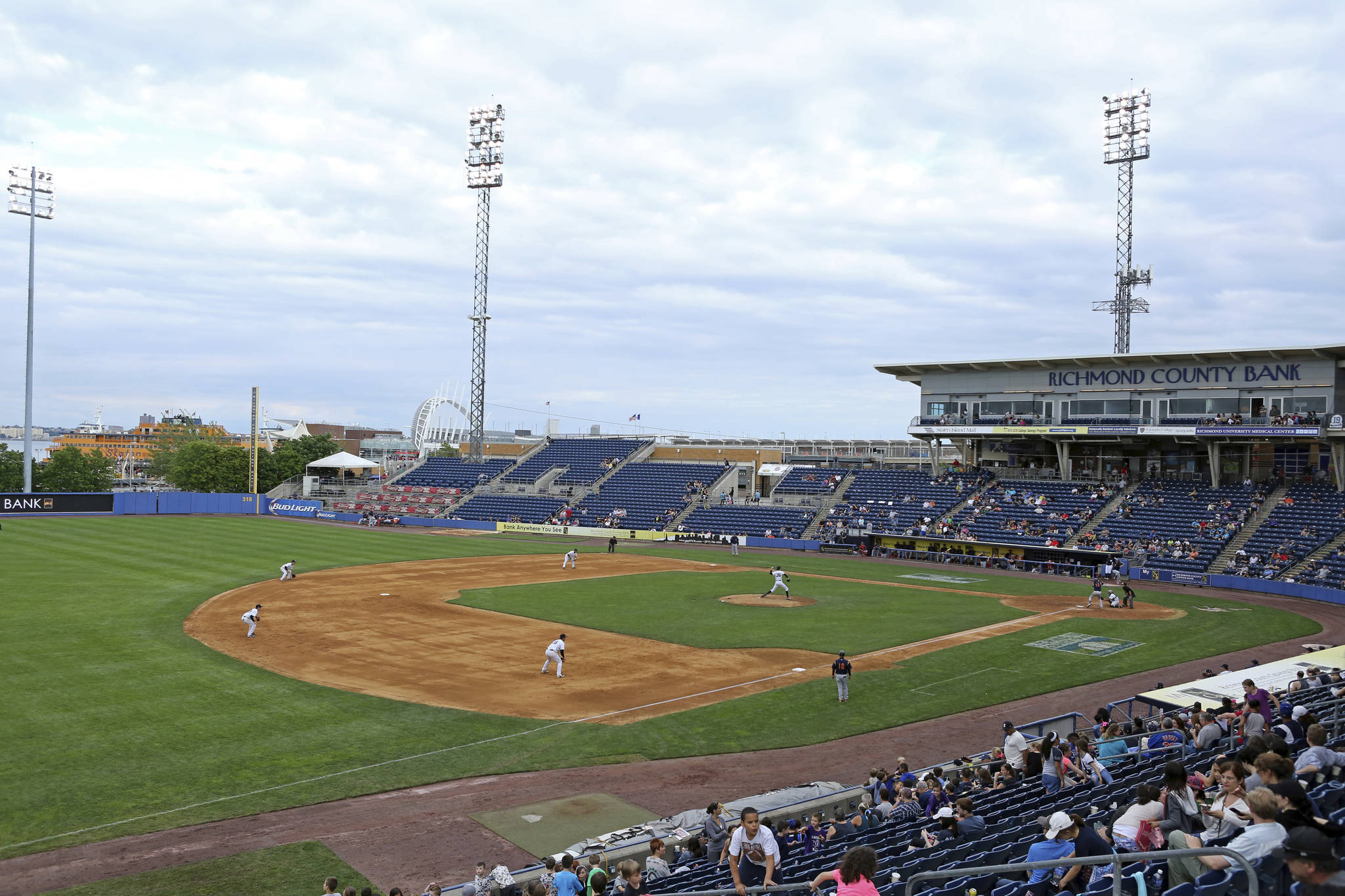 This June 2015 photo shows an overall view of the Staten Island Yankees in action against the State College Spikes at Richmond County Bank Ballpark during a minor league baseball game in Staten Island, N.Y. The owners of the Staten Island Yankees announced in a statement Thursday, Dec. 3, 2020, that with “great regret, we must cease operations.” They also said they were suing the New York Yankees and Major League Baseball “to hold those entities accountable for false promises” that they would always keep the team as a farm club. (AP Photo / Gregory Payan)