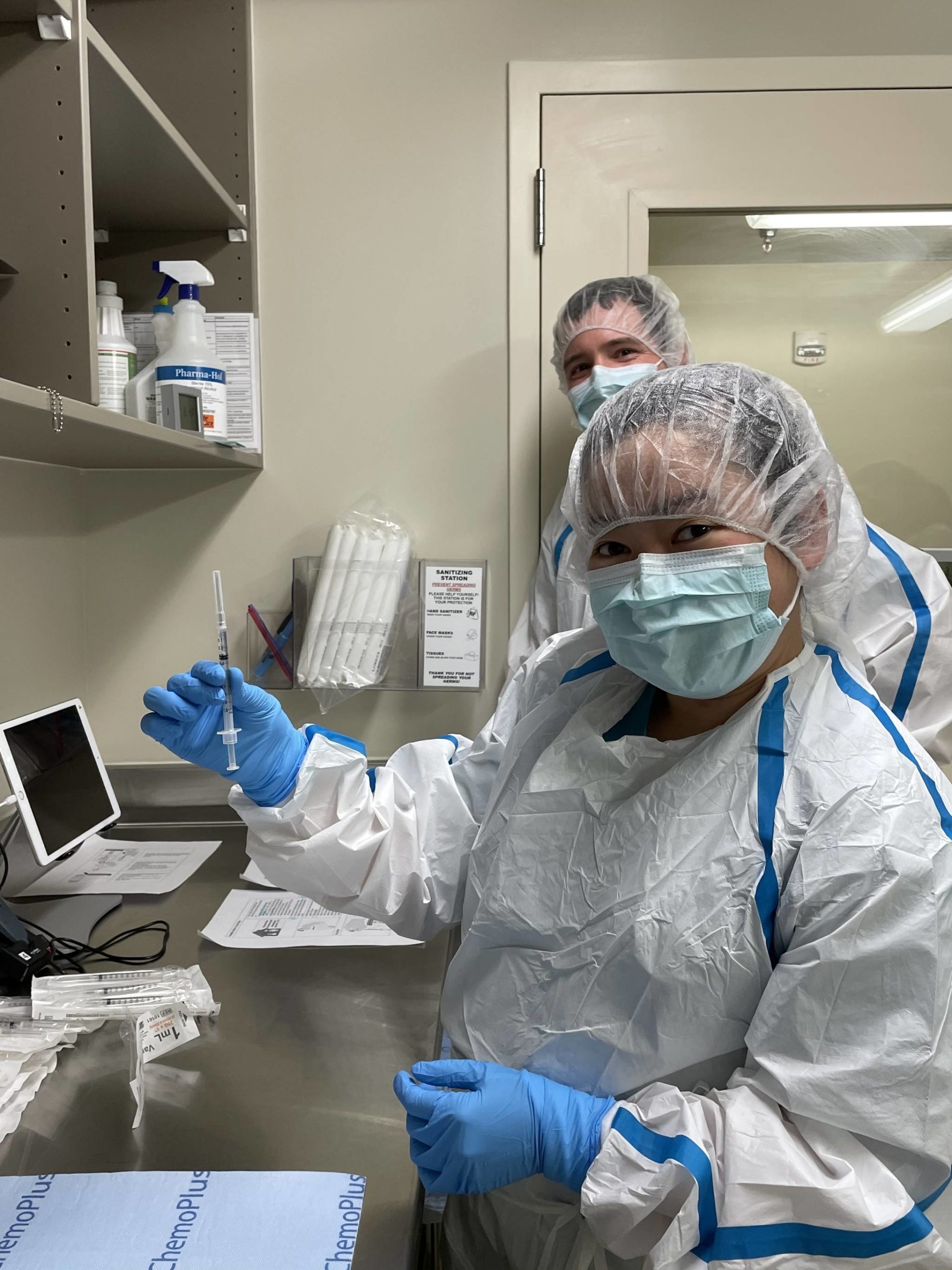 Courtesy photo / Katie Bausler
Krischelle Batac and Justin Richardson, pharmacy technicians with Bartlett Regional Hospital, prepares the first dose of the Pfizer/BioNTech coronavirus vaccine Tuesday.