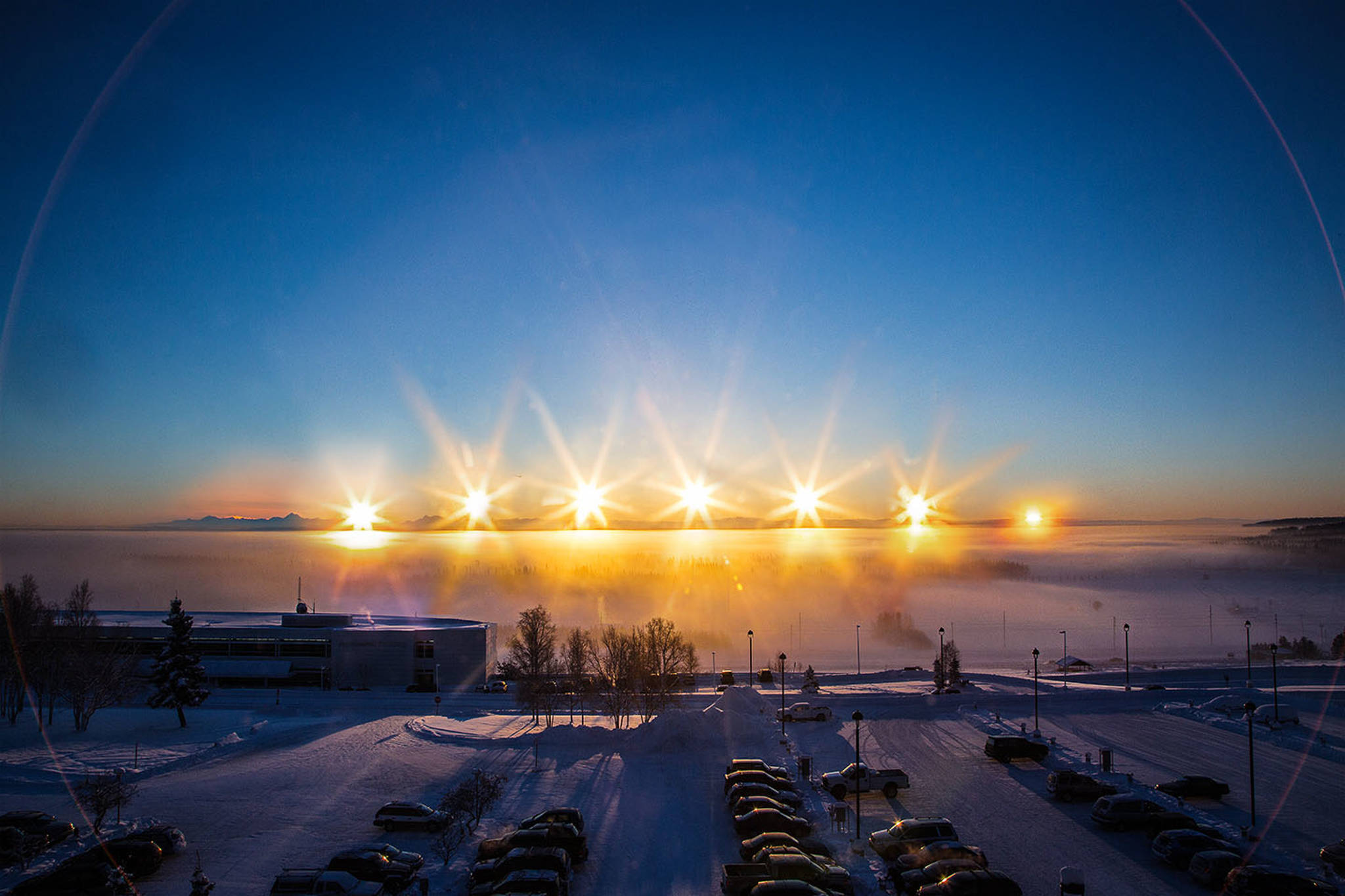 A multiple-exposure photo of the winter-solstice sun arcing over the Alaska Range, taken from the University of Alaska Fairbanks campus on Dec. 21, 2012. (Courtesy Photo / Todd Paris)