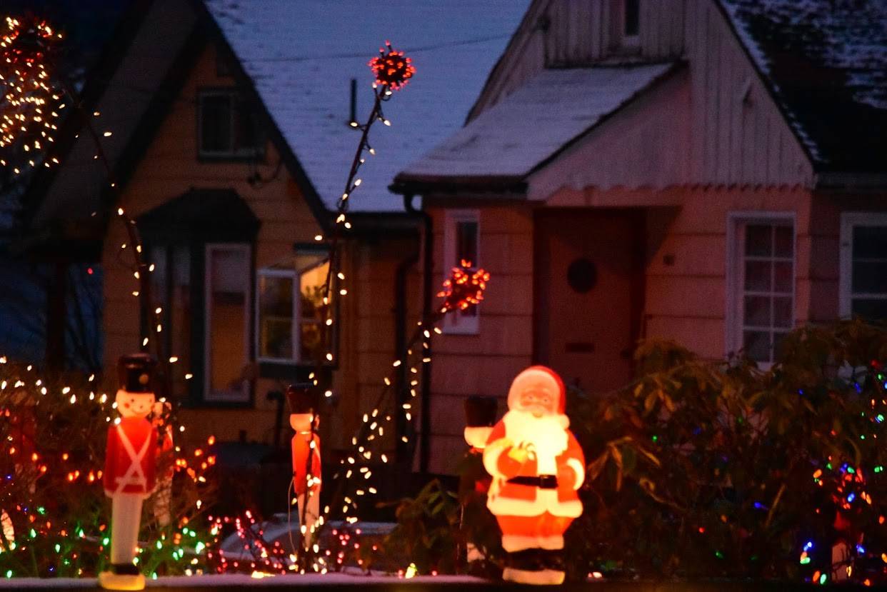 Peter Segall / Juneau Empire
Santa stands among festive lights near B Street and West 11th Street near Northern Light United Church.