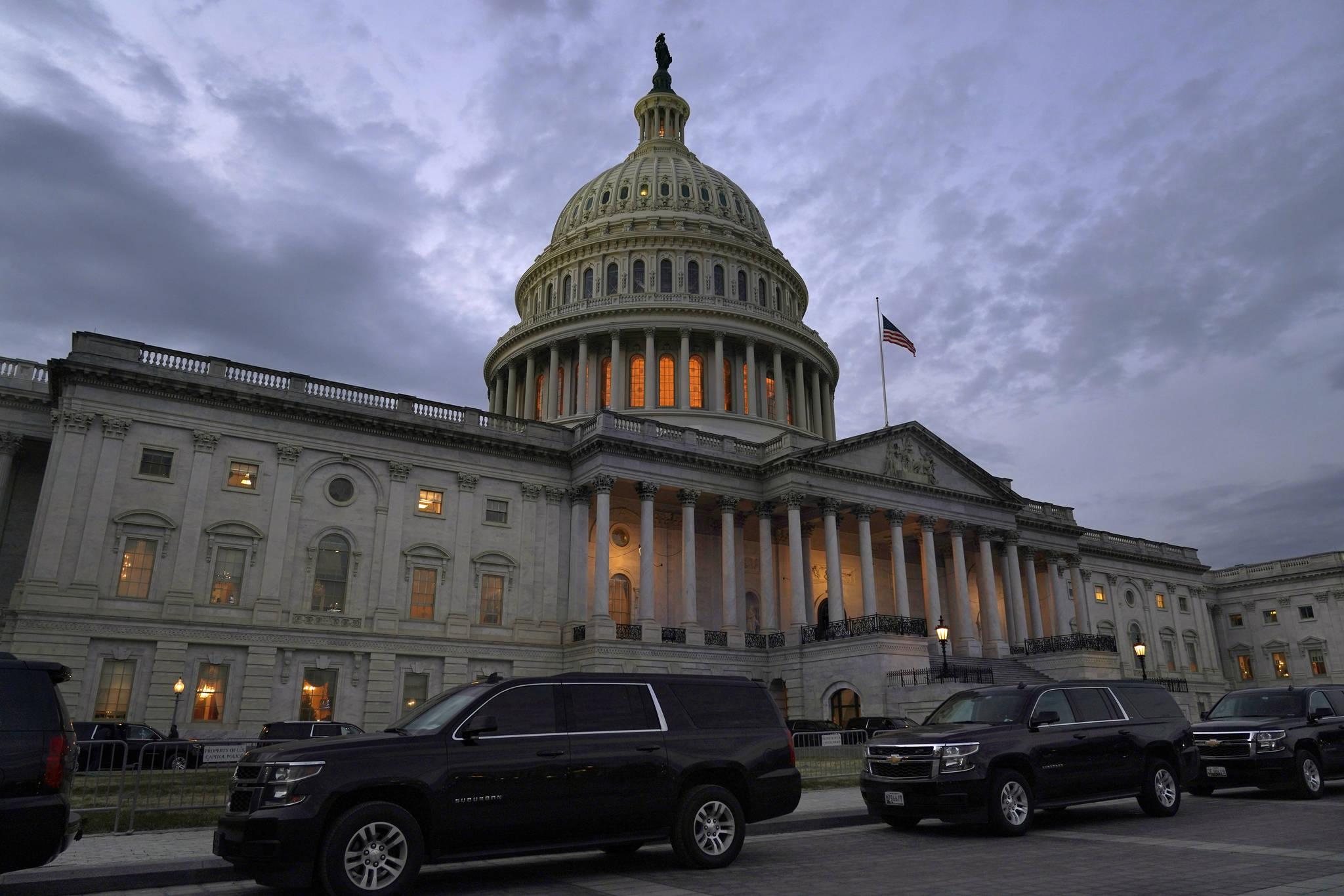 Dusk falls over the Capitol, Monday, Dec. 21, 2020, in Washington. Congressional leaders have hashed out a massive, year-end catchall bill that combines $900 billion in COVID-19 aid with a $1.4 trillion spending bill and reams of other unfinished legislation on taxes, energy, education and health care. (AP Photo / Jacquelyn Martin)