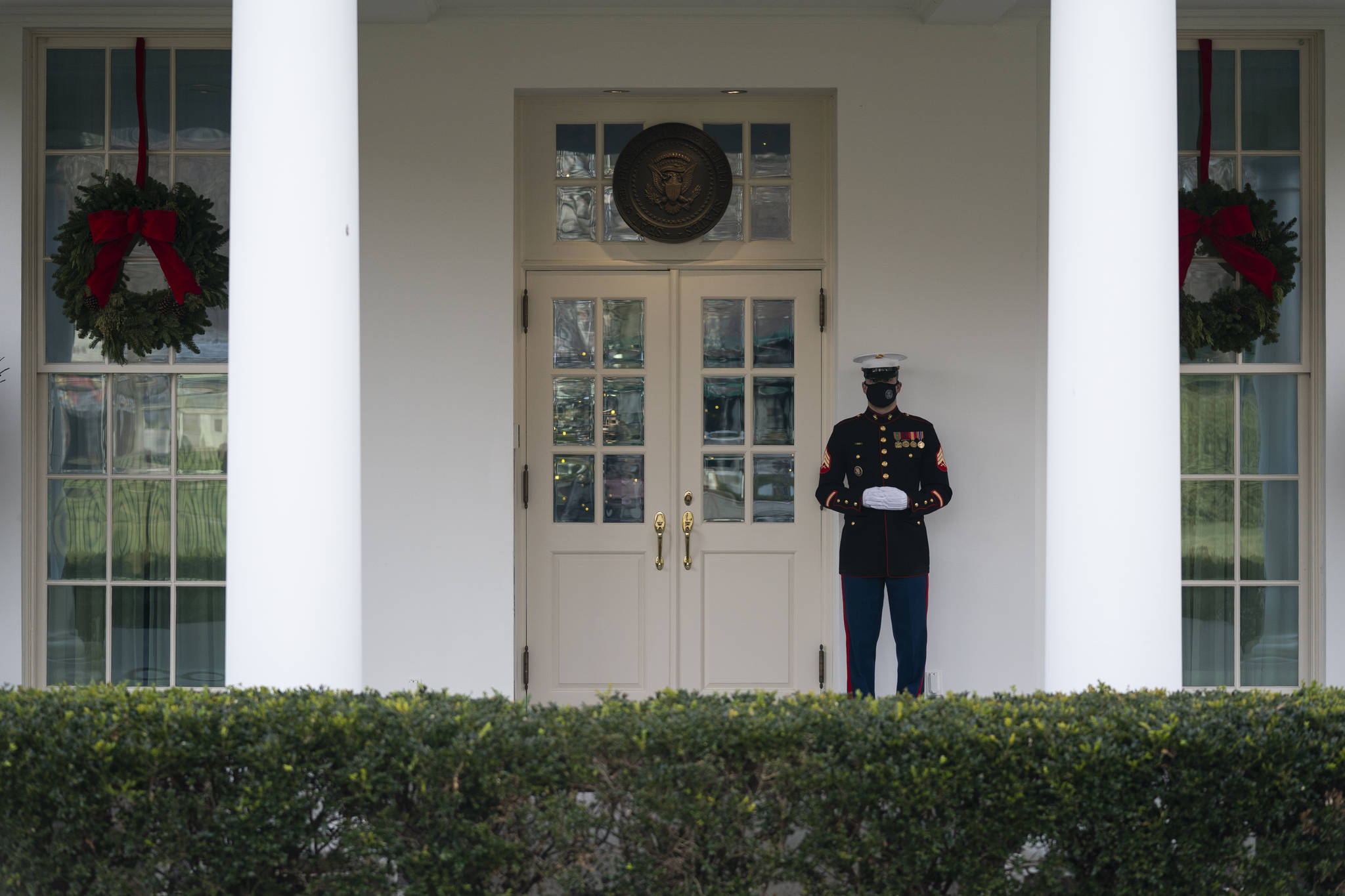 AP Photo / Evan Vucci
A Marine stands outside the entrance to the West Wing of the White House on Monday, signifying the President is in the Oval Office.