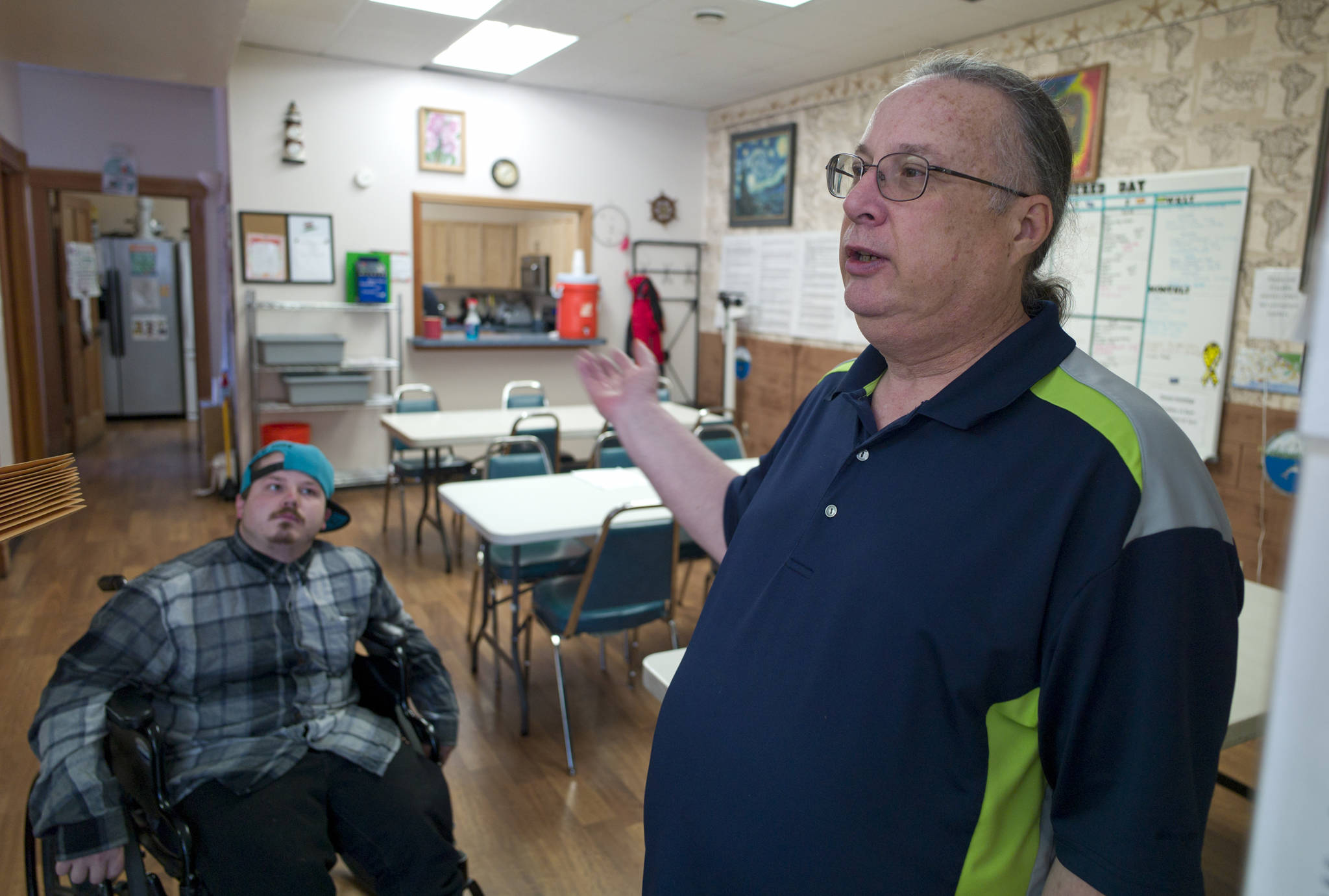 Michael Penn / Juneau Empire File
Bruce Van Dusen, executive director of Polaris House, right, and staff member Levi LeCount give a tour of Polaris House in May 2017. Despite the challenges of the pandemic and a wreck that left them without a truck, work continues at Polaris House this holiday season.