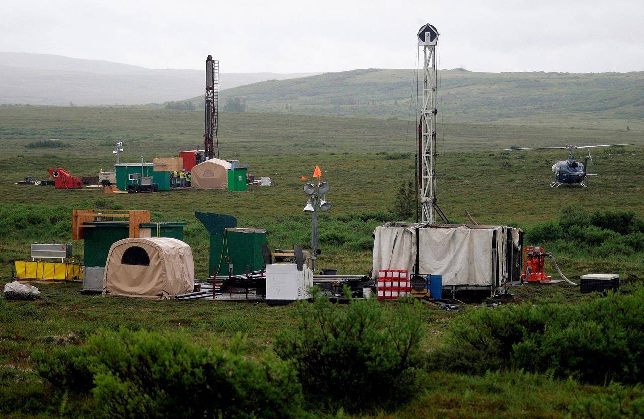 In this July 13, 2007, file photo, workers with the Pebble Mine project test drill in the Bristol Bay region of Alaska, near the village of Iliamma. (AP Photo / Al Grillo)