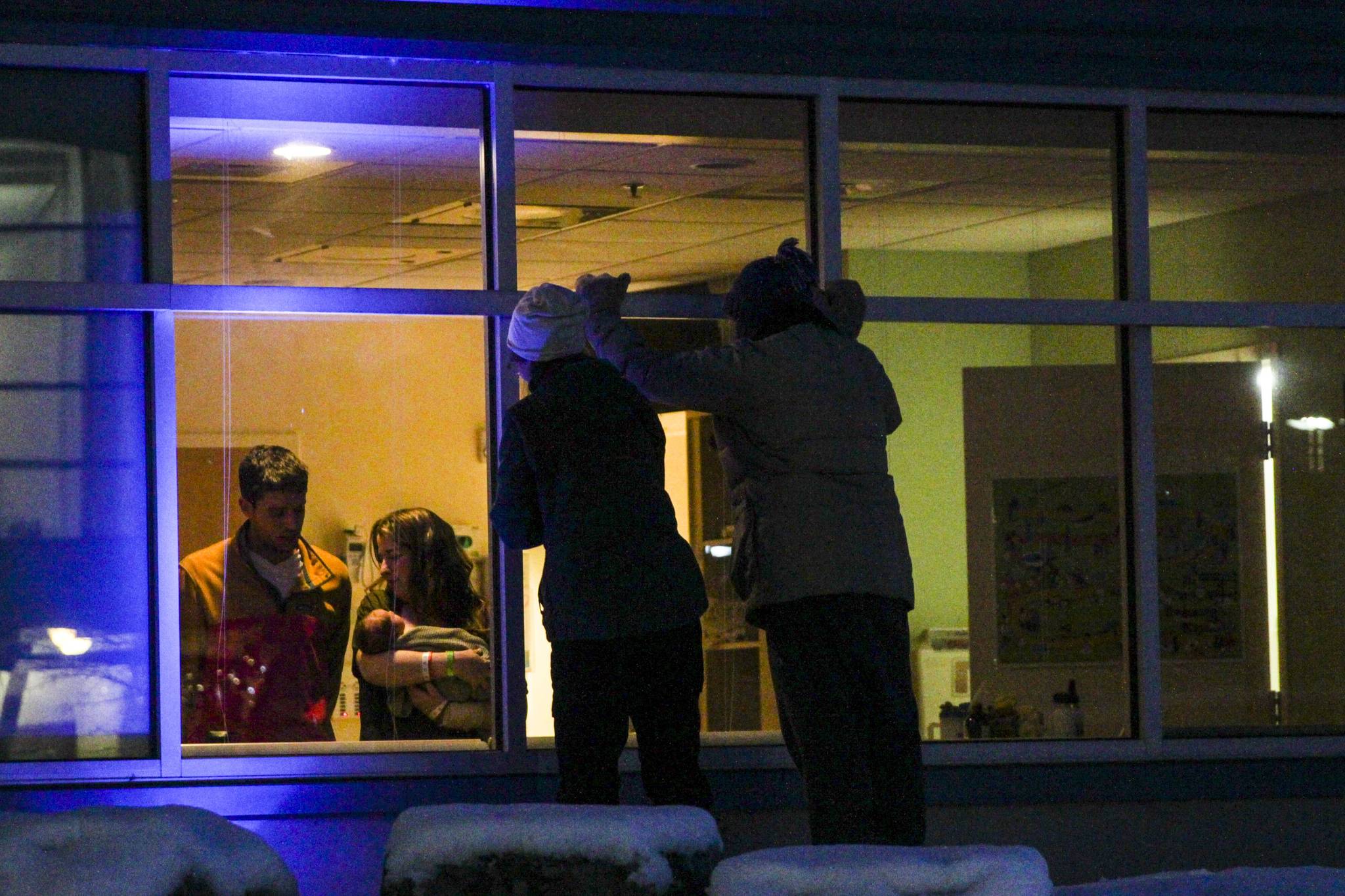 Michael S. Lockett / Juneau Empire
People gather to view a child through a window at Bartlett Regional Hospital on Dec. 15. Juneau and Alaska’s overall population is shrinking due to high numbers of emigrating boomers and low numbers of childbirths.