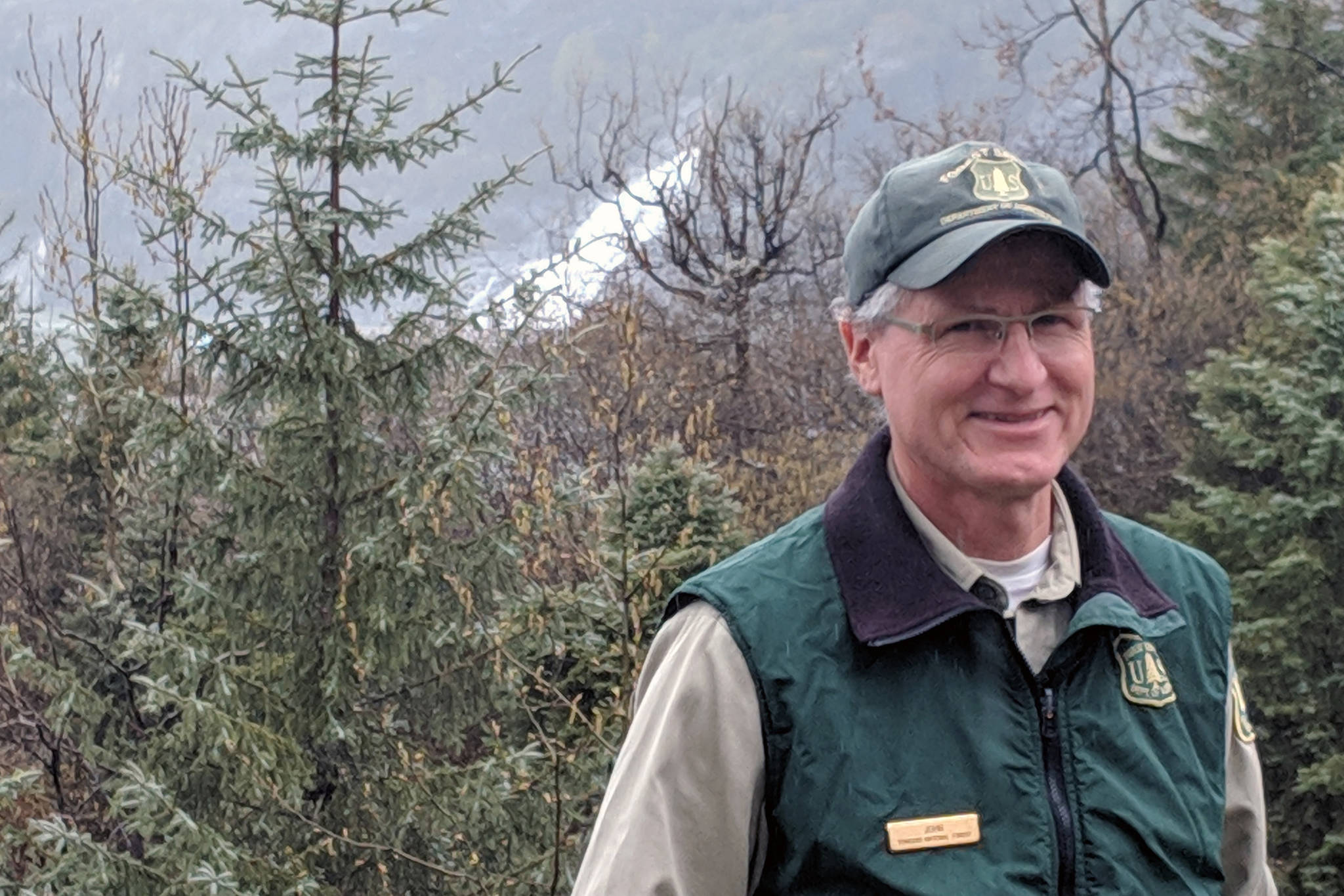 Then-Mendenhall Glacier Visitor Center Director John Neary smiles outside the visitor center, May 3, 2019. (Ben Hohenstatt / Juneau Empire File)