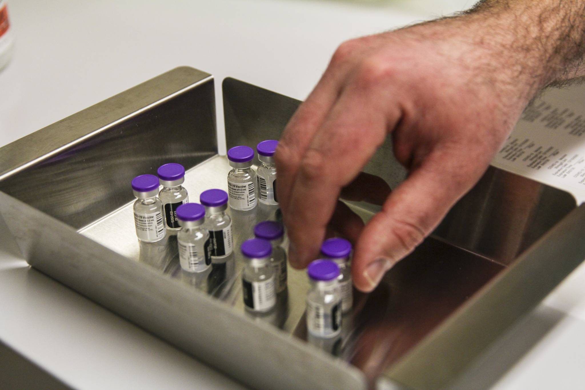 This photo shows vials of COVID-19 vaccine on Dec. 15, 2020. Rollout to the next group of eligible recipients, Alaska residents 65 or over, has been weighted by technical issues and limited vaccine supplies. (Michael S. Lockett / Juneau Empire)
