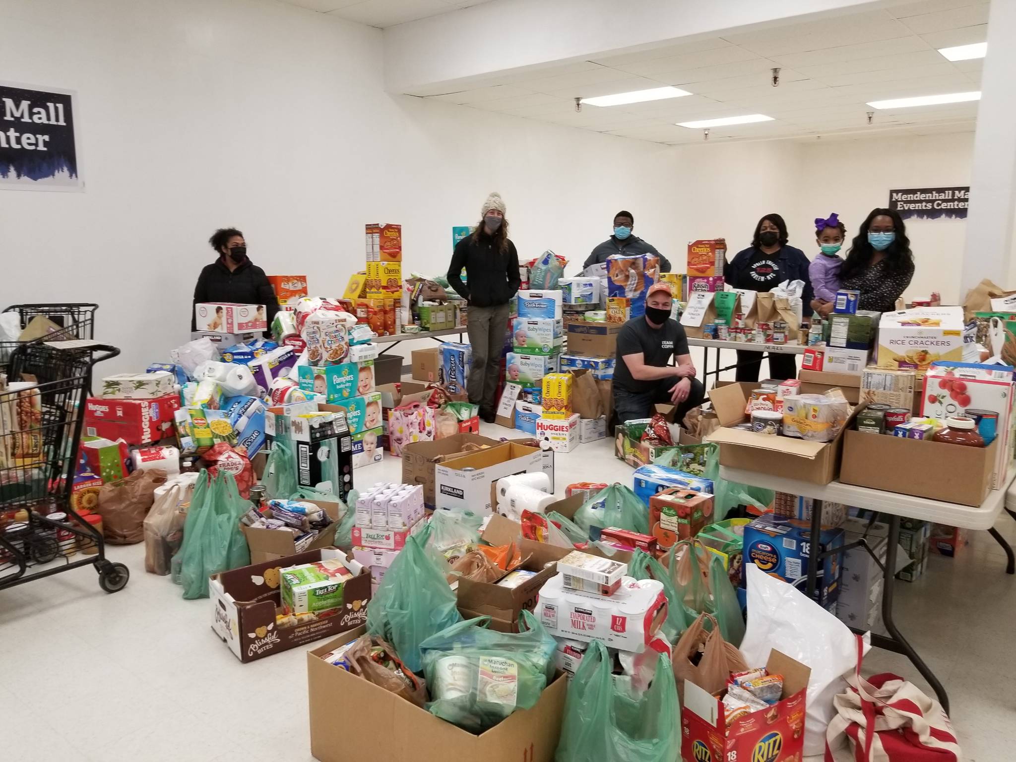 Members of the Black Awareness Association of Juneau and other volunteers collect donations from Juneau residents from their Martin Luther King Jr. Day donation drive on Jan. 18, 2021. (Courtesy photo / Black Awareness Association of Juneau)