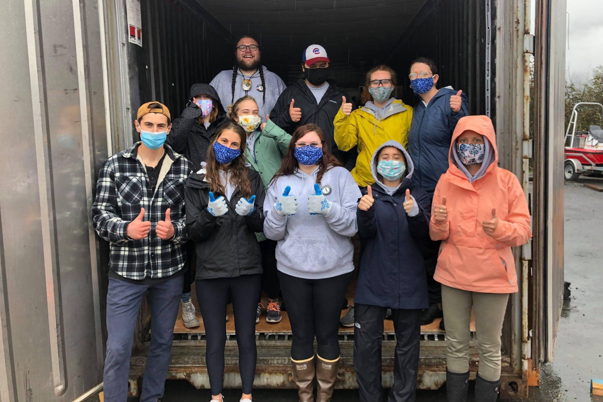 AmeriCorps members pose with a Conex box full of PPE they helped to load for Central Council Tlingit and Haida Indian Tribes of Alaska during a day of service on Sept. 11, 2020. The members are also assisting with early literacy programs. (Courtesy photo / Jordan Frodge)