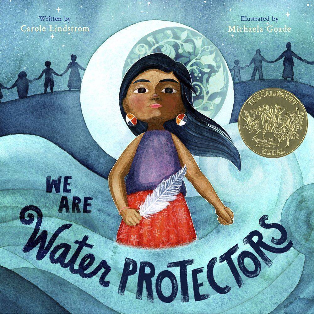 This cover image released by Roaring Brook Press shows “We Are Water Protectors,” written by Carol Lindstrom and illustrated by Michaela Goade. Goade became the first Native American to win the prestigious Randolph Caldecott Medal for best children’s picture story. Goade is a member of the Tlingit and Haida Indian tribes in Southeast Alaska. “We Are Water Protectors,” is a call for environmental protection that was conceived in response to the planned construction of the Dakota Access Pipeline through Standing Rock Sioux territory. (Roaring Brook Press)