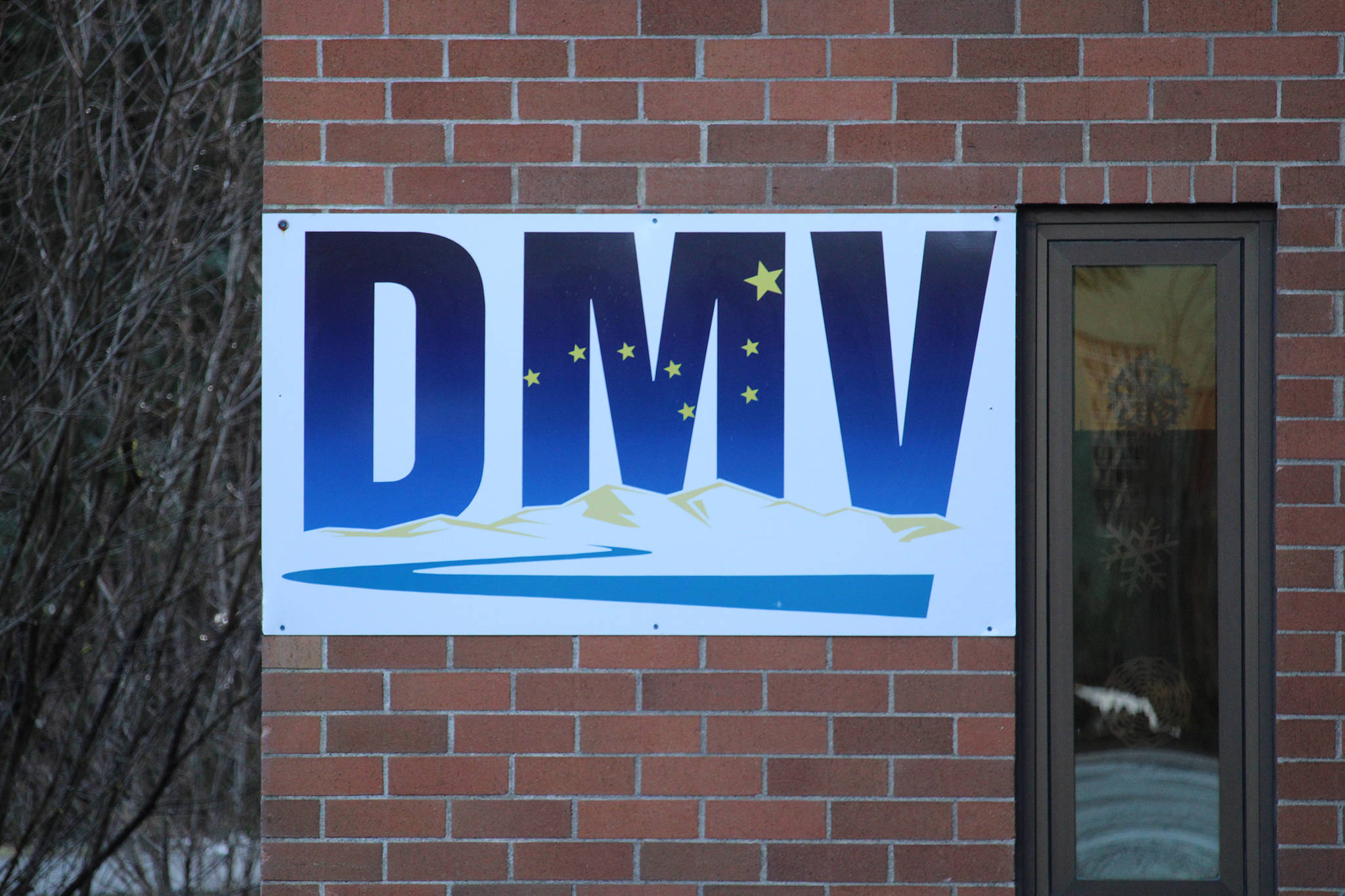This photo shows a sign marking the Division of Motor Vehicles office in the Mendenhall Valley area of Juneau. Department of Administration Commissioner Kelly Tshibaka announced Monday that she was ordering a review of Division of Motor Vehicles processes to determine how plates reading 3REICH were issued. (Ben Hohenstatt / Juneau Empire File)