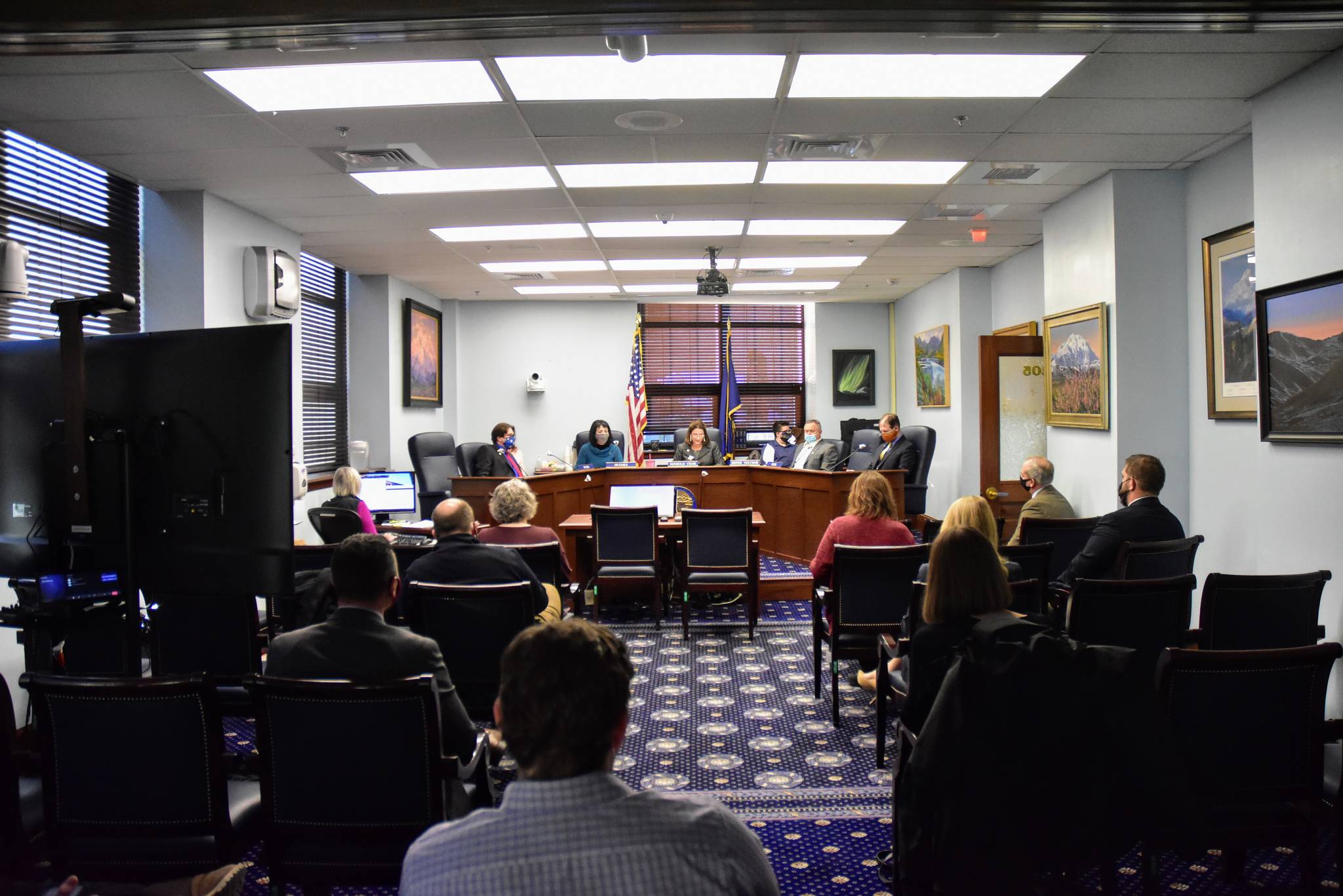 Staff, lawmakers and members of the press gather for the first Senate Judiciary Committee meeting of the 32nd Legislature on Wednesday, Jan. 27, 2021. While Senators moved ahead with work, the House of Representatives was once again unable to organize. (Peter Segall/Juneau Empire)