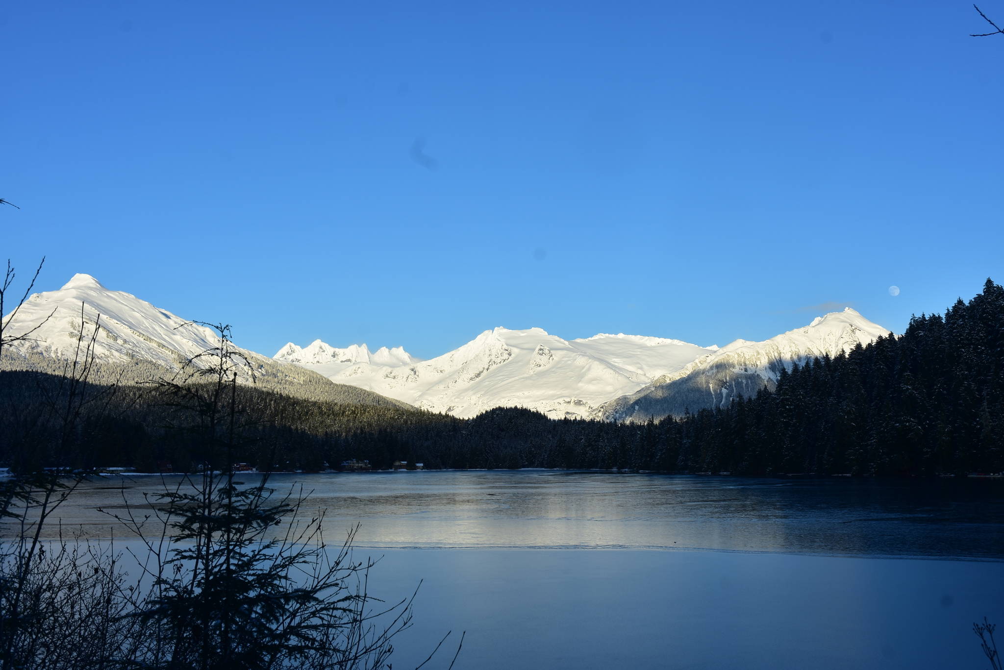 After weeks of nearly omnipresent rain, there have recently been blue skies in Juneau. This photo shows Auke Lake on a recent sunny day. (Peter Segall / Juneau Empire)