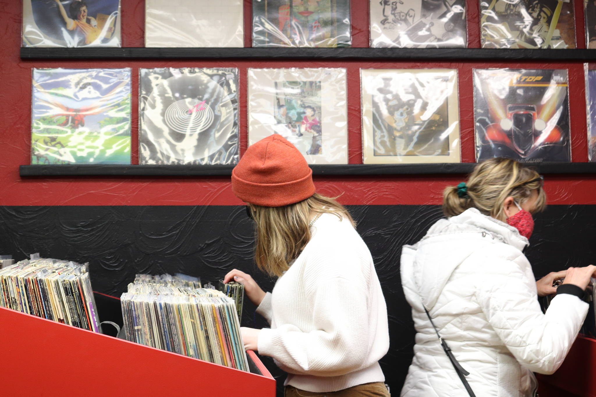 Kaitlyn (left) and Tracy Forst (right) look through records at Hi-Fi Senpai on Saturday, Jan. 30. The two left with vinyl copies of albums by ABBA and Styx. (Ben Hohenstatt / Juneau Empire)
