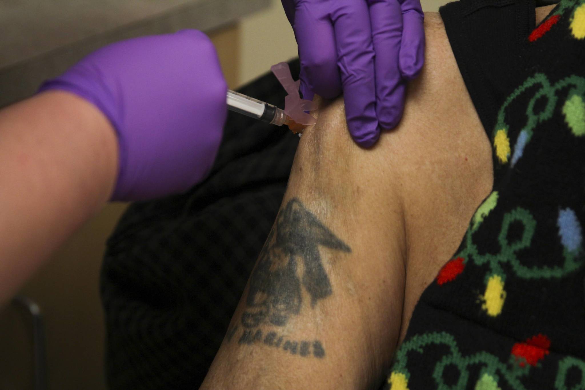 In this Dec. 24 photo, Arsenio Pastor Credo receives the Moderna coronavirus vaccine from nurse Courtney Taber at the Southeast Alaska Regional Health Consortiums Ethel Lund Medical Center. (Michael S. Lockett / Juneau Empire File)