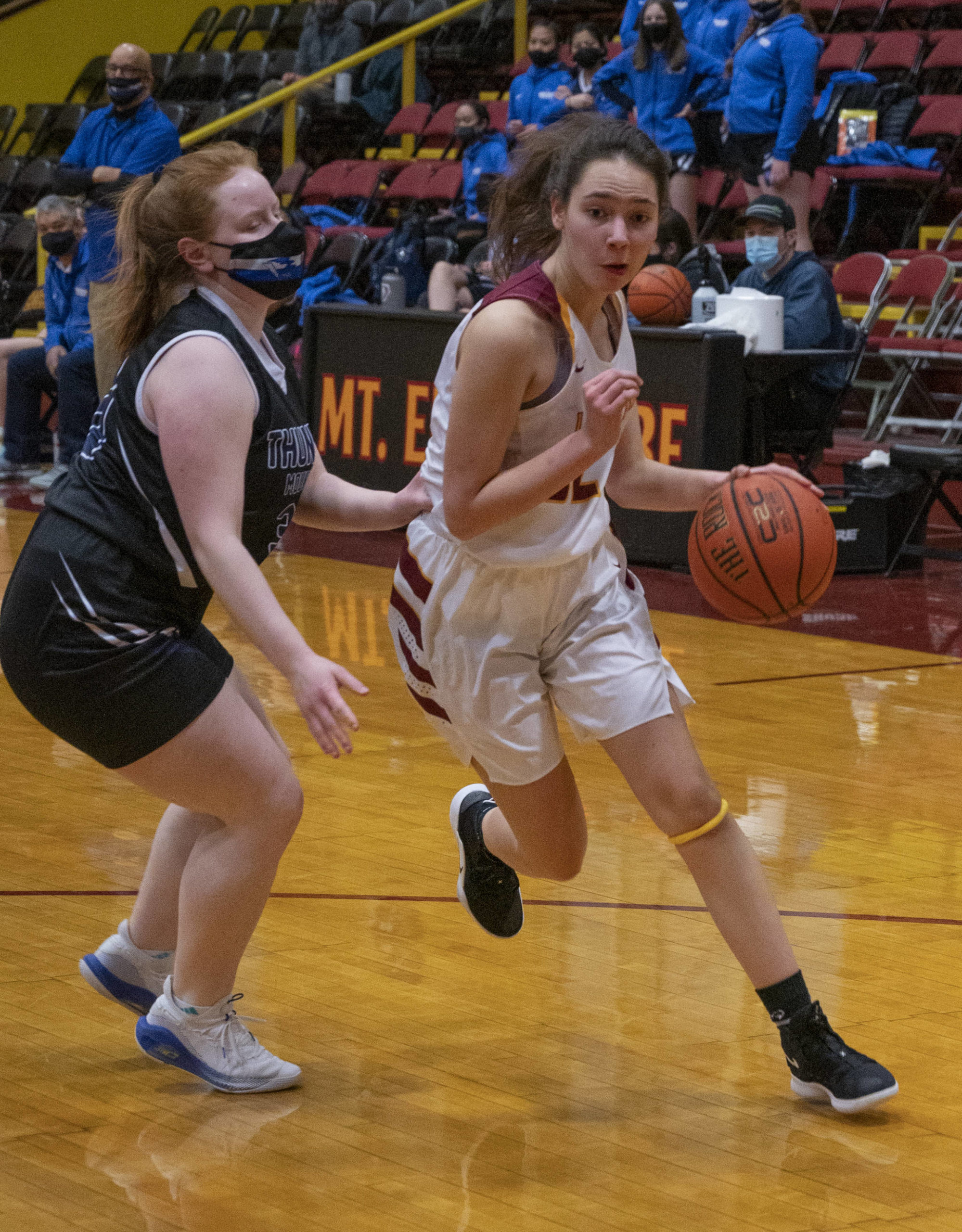 Thunder Mountain High School player Mackenzie Gray, left, competes against Mt. Edgecumbe High School in Sitka on Saturday, Feb. 6, 2021. (Sitka Sentinel / James Poulson)