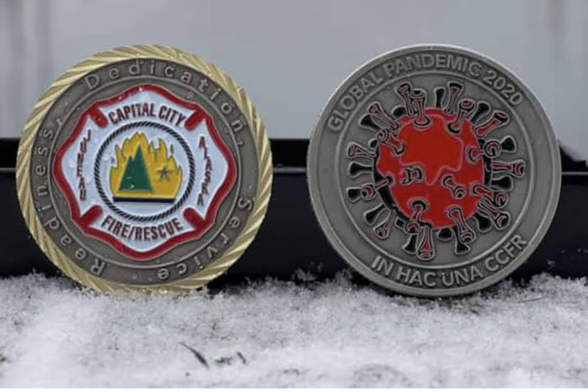 Capital City Fire/Rescue recently distributed challenge coins as a thank you to the emergency workers and staff who assisted with COVID-19 testing at the Juneau International Airport from March 2020 until Jan. 31. On Feb. 1, state contractor Capstone took over airport testing. (Courtesy Photo/City and Borough of Juneau)