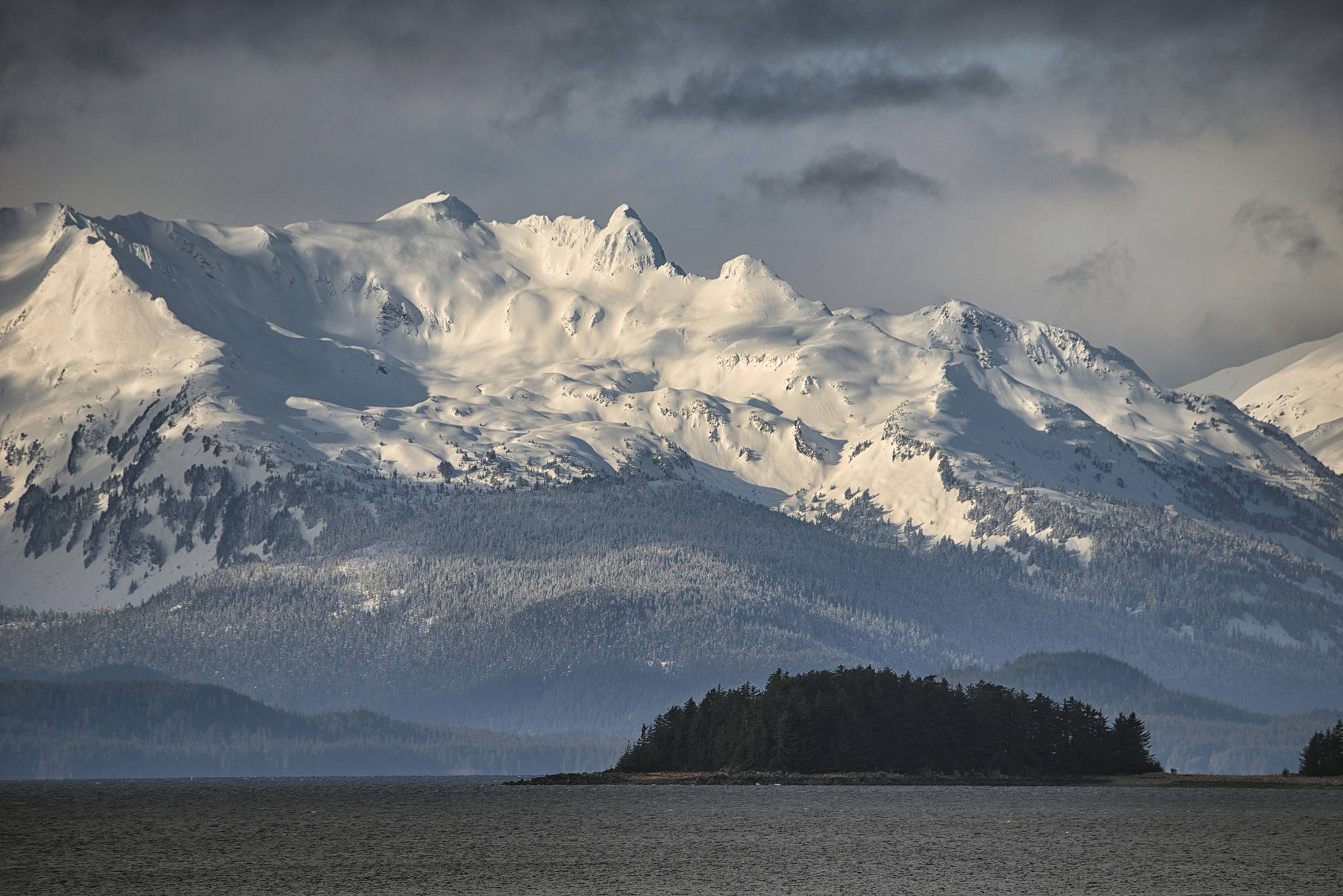 The Chilkat Mountains tower above William Henry Bay in this Friday, Feb. 26 photo. (Courtesy Photo / Kenneth Gill, gillfoto)