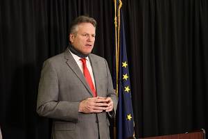 Courtesy photo / Office of Gov. Mike Dunleavy
Gov. Mike Dunleavy speaks at an Anchorage news conference on Dec. 11. In a Sunday news conference, Dunleavy discussed the end of Alaska’s longtime COVID-19 disaster declaration and what it means for the state’s response to the virus.