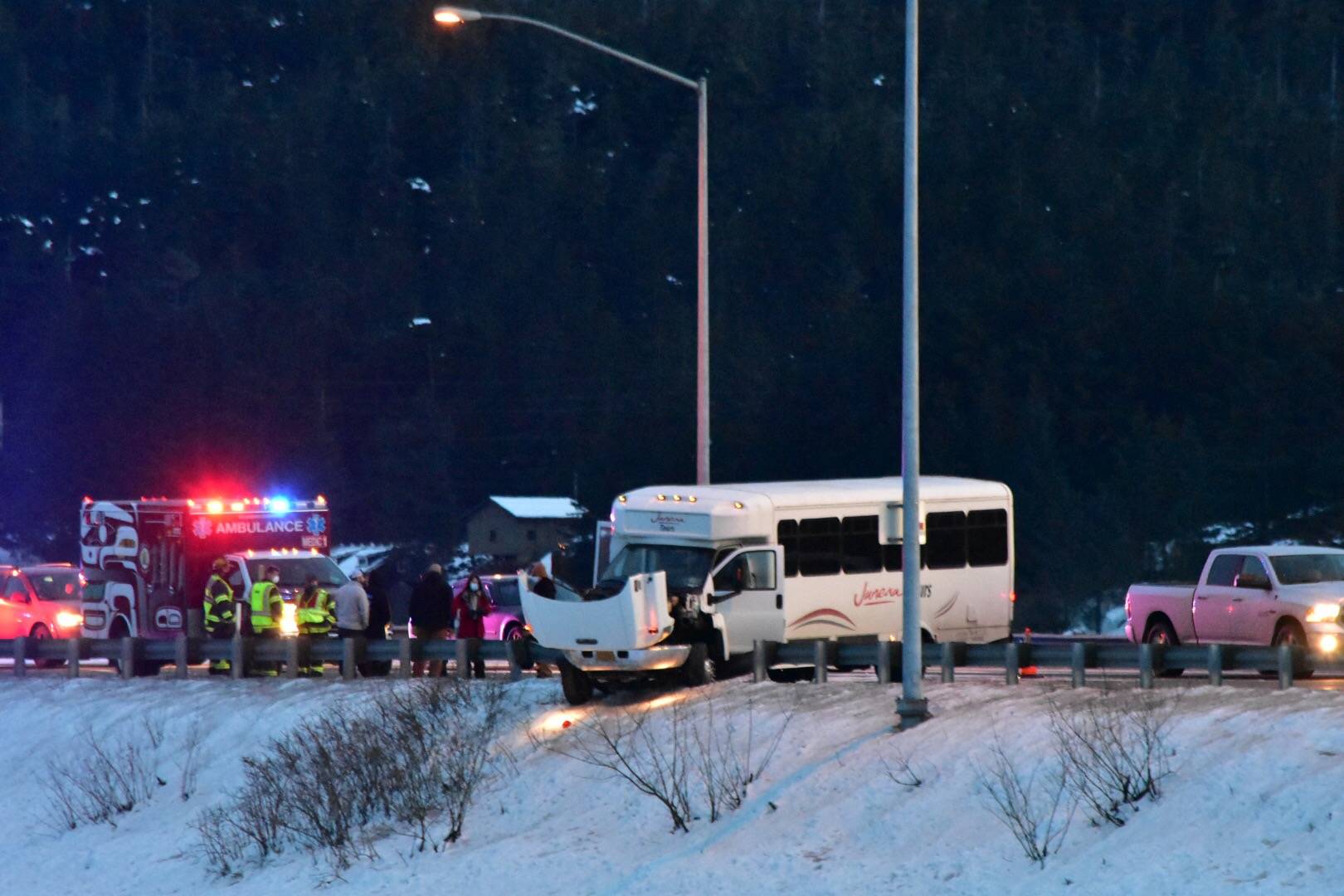 A Juneau Tours minibus crashed into a guardrail on Egan Drive near Twin Lakes for reasons unknown on Feb. 15, 2021. (Peter Segall / Juneau Empire)