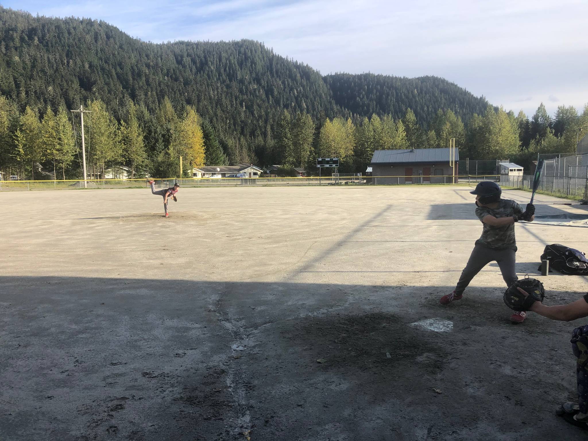 Youths play sandlot baseball at Miller Field in the summer of 2020. After COVID-19 sidelined a competitive season last summer, local players gathered to play sandlot ball. Thanks to a city-approved COVID-19 mitigation plan, the Gastineau Channel Baseball and Softball Leagues are planning a full, competitive season this summer. Registration is now open for players between the ages of 5 and 16. (Courtesy photo/Geoff Kirsch)
