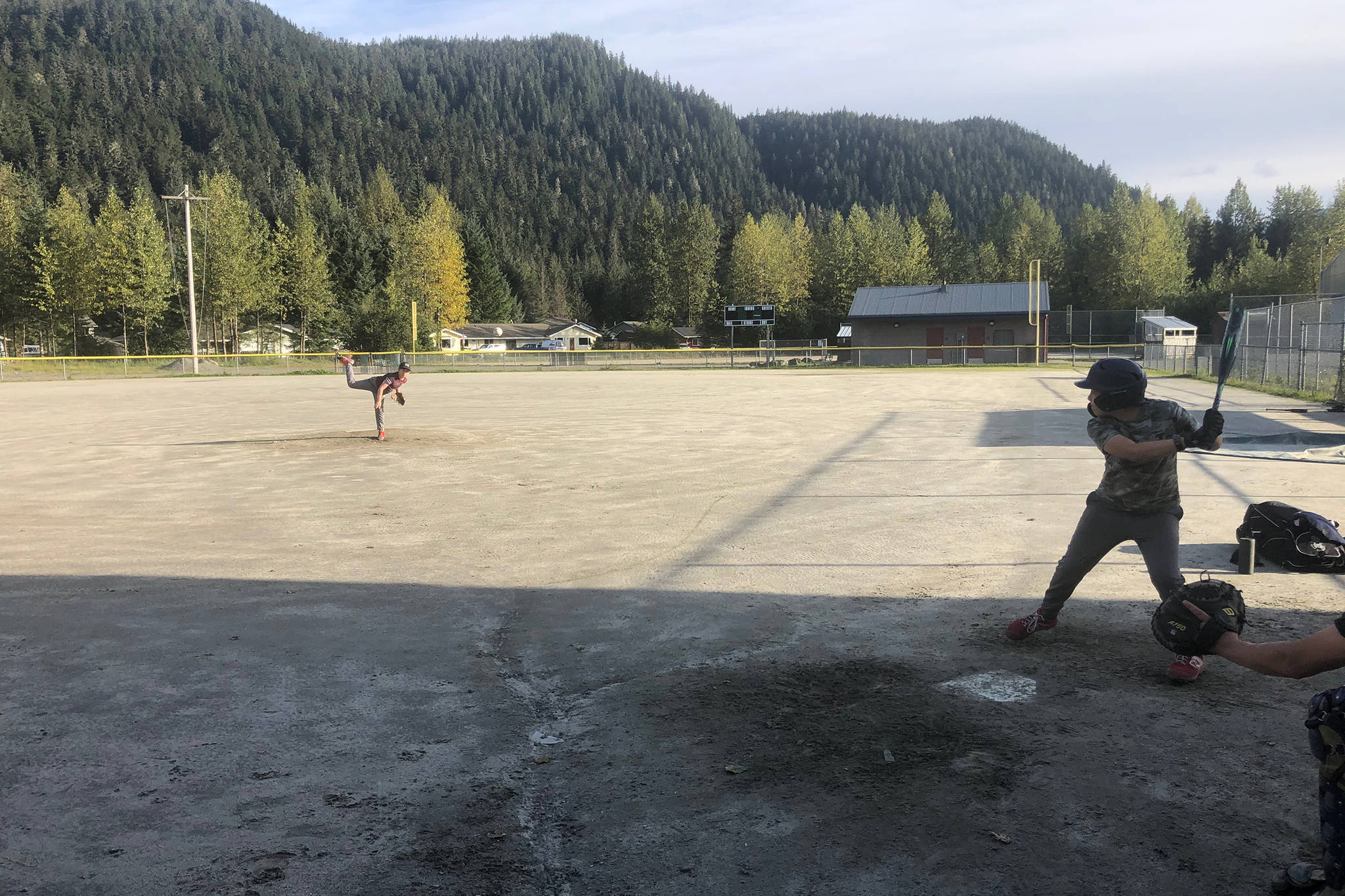 Youths play sandlot baseball at Miller Field in the summer of 2020. After COVID-19 sidelined a competitive season last summer, local players gathered to play sandlot ball. Thanks to a city-approved COVID-19 mitigation plan, the Gastineau Channel Baseball and Softball Leagues are planning a full, competitive season this summer. Registration is now open for players between the ages of 5 and 16. (Courtesy Photo / Geoff Kirsch)