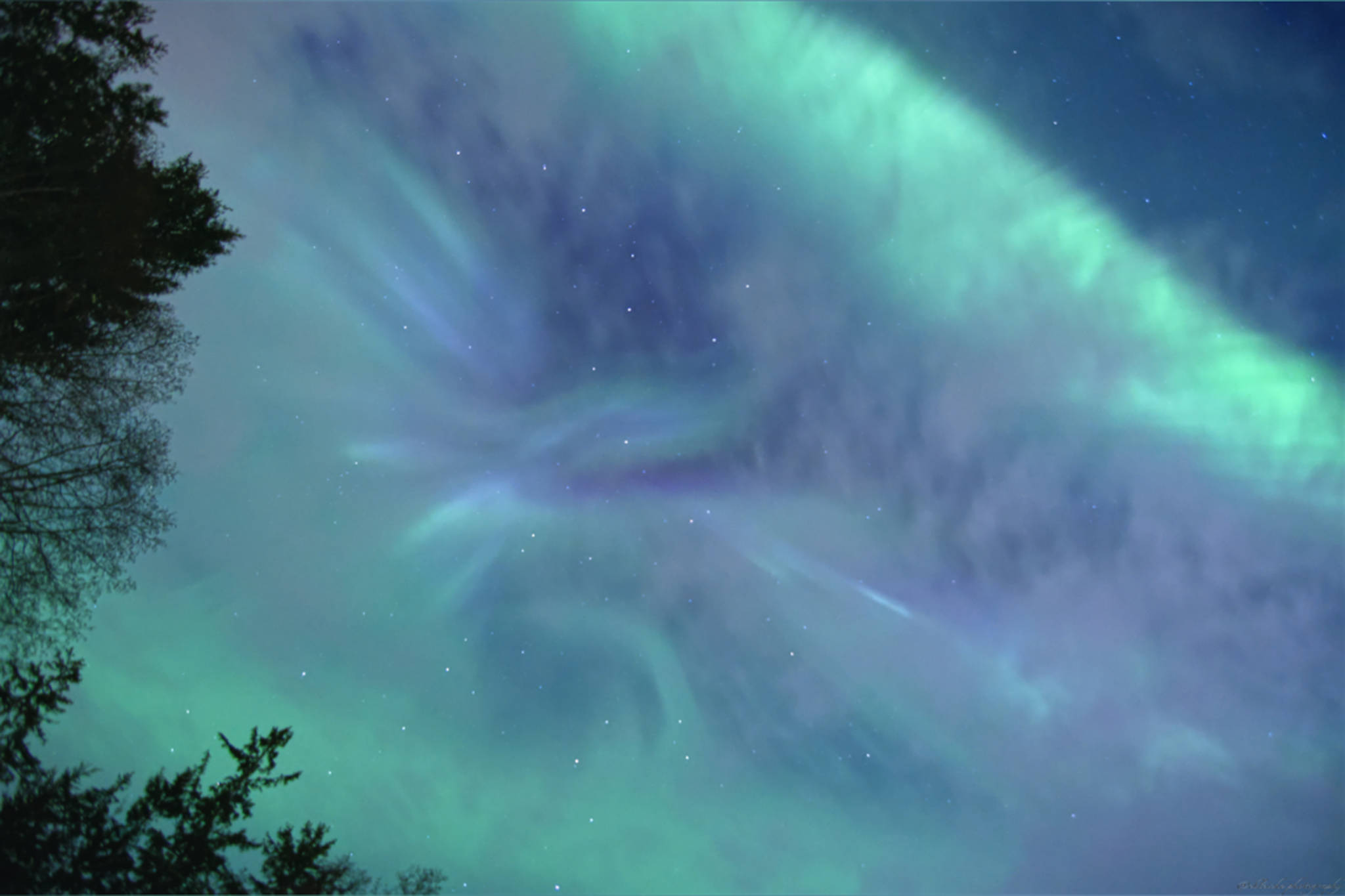 A brief break in the clouds at Lena Cove exposes an auroral corona on the night of Friday, March 19. (Courtesy Photo / Eric Bleicher, @ebleiche)