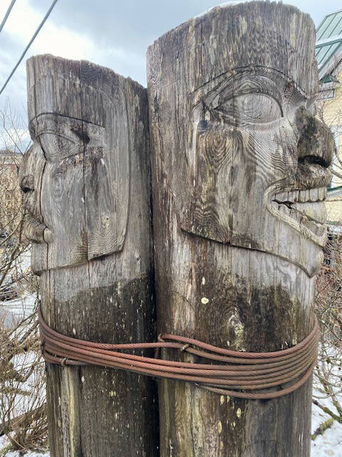 These old totems, seen on March 15, have kept watch over downtown for many years. (Courtesy Photo / Denise Carroll)