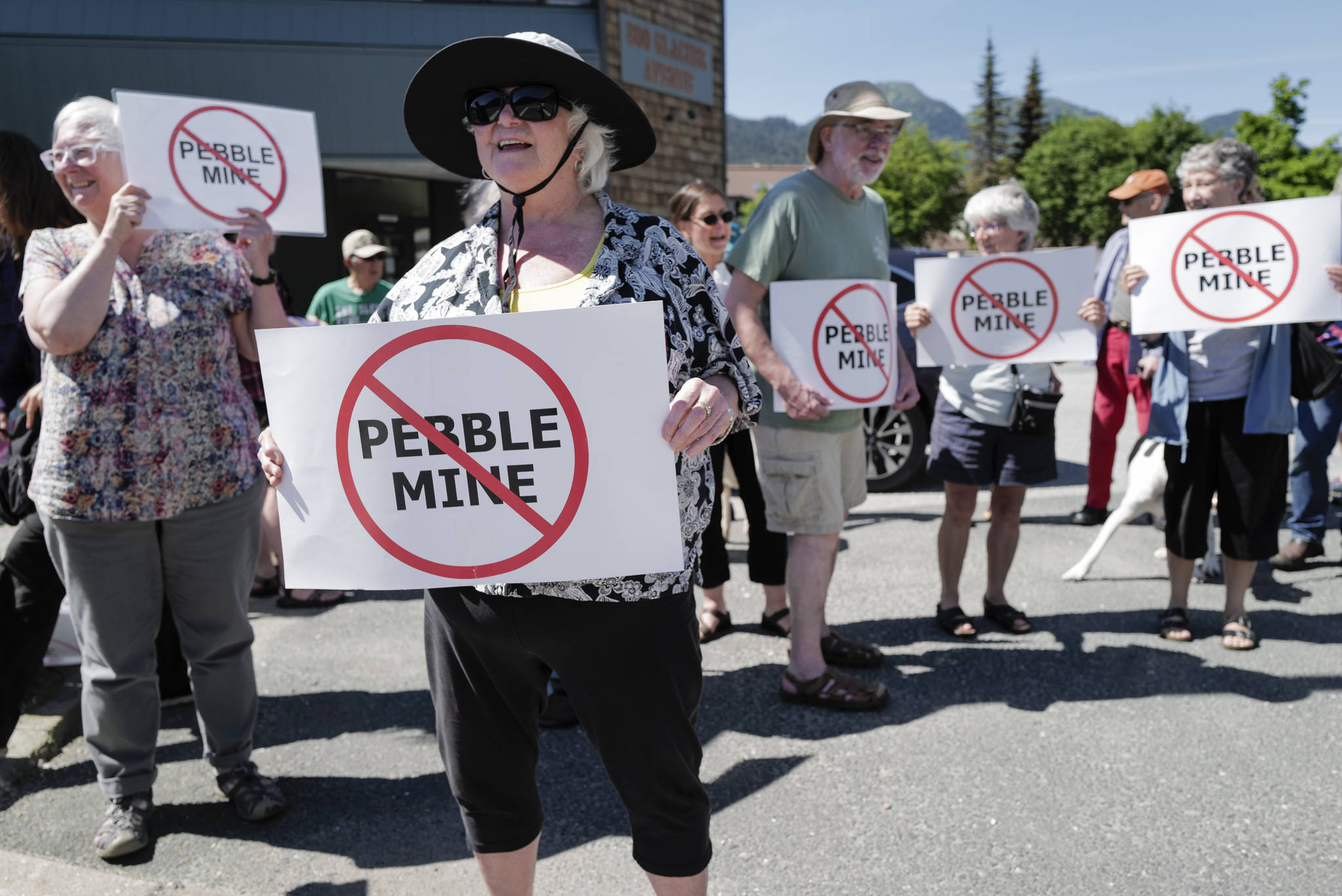 Judy Cavanaugh stands with others at a rally against the Pebble Mine in front of Sen. Lisa Murkowski’s Juneau office in June 2019.  The Army Corps of Engineers has accepted a request for administrative appeal filed by Pebble Limited Partnership. A similar effort by the state was reject, Gov. Mike Dunleavy said in a news release. (Michael Penn / Juneau Empire File)