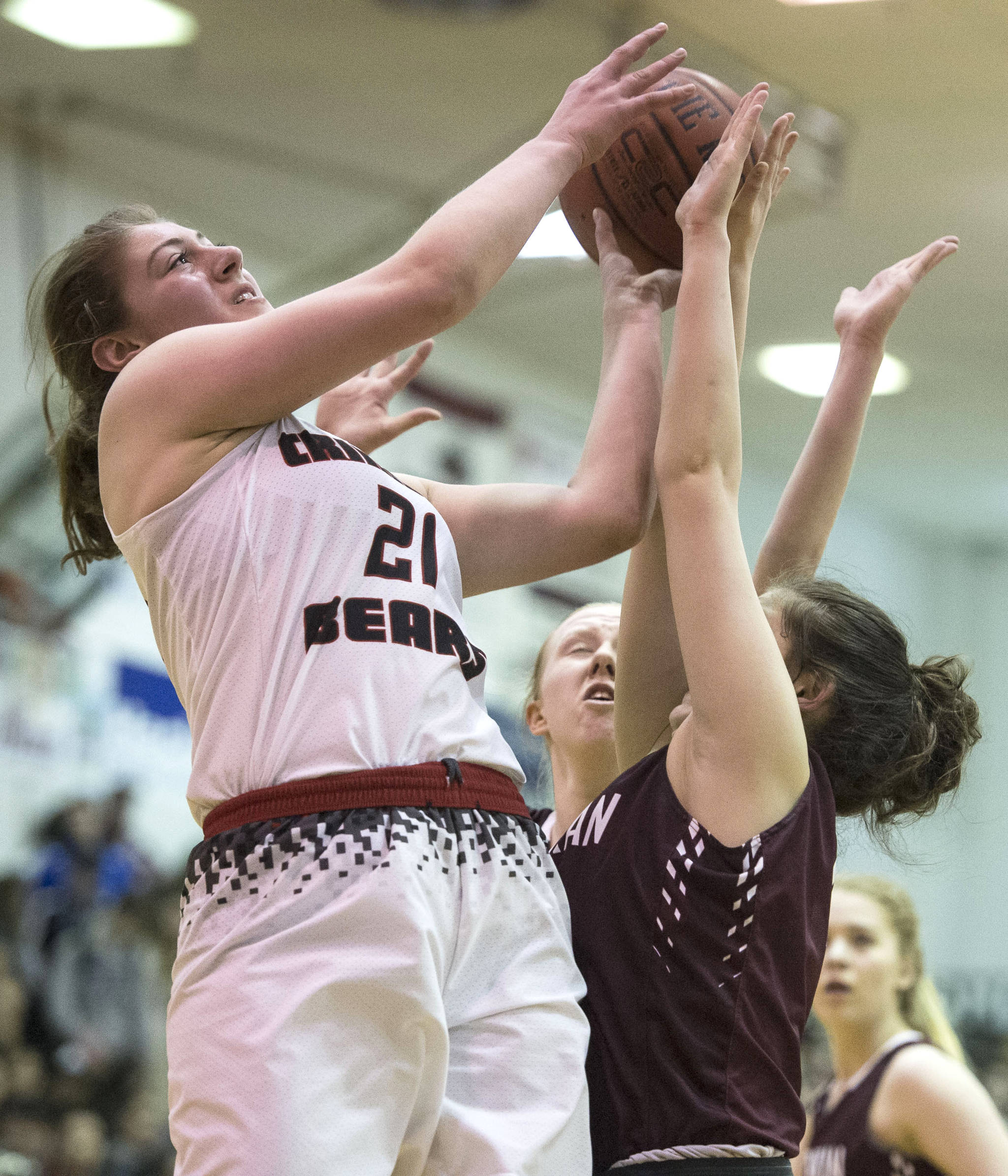 Michael Penn / Juneau Empire File
Juneau-Douglas’s Cassie Dzinich, left, shoots against Ketchikan during the Region V Basketball finals at JDHS on March 10, 2017. Ketchikan won 41-39 to force a playoff game the next day.