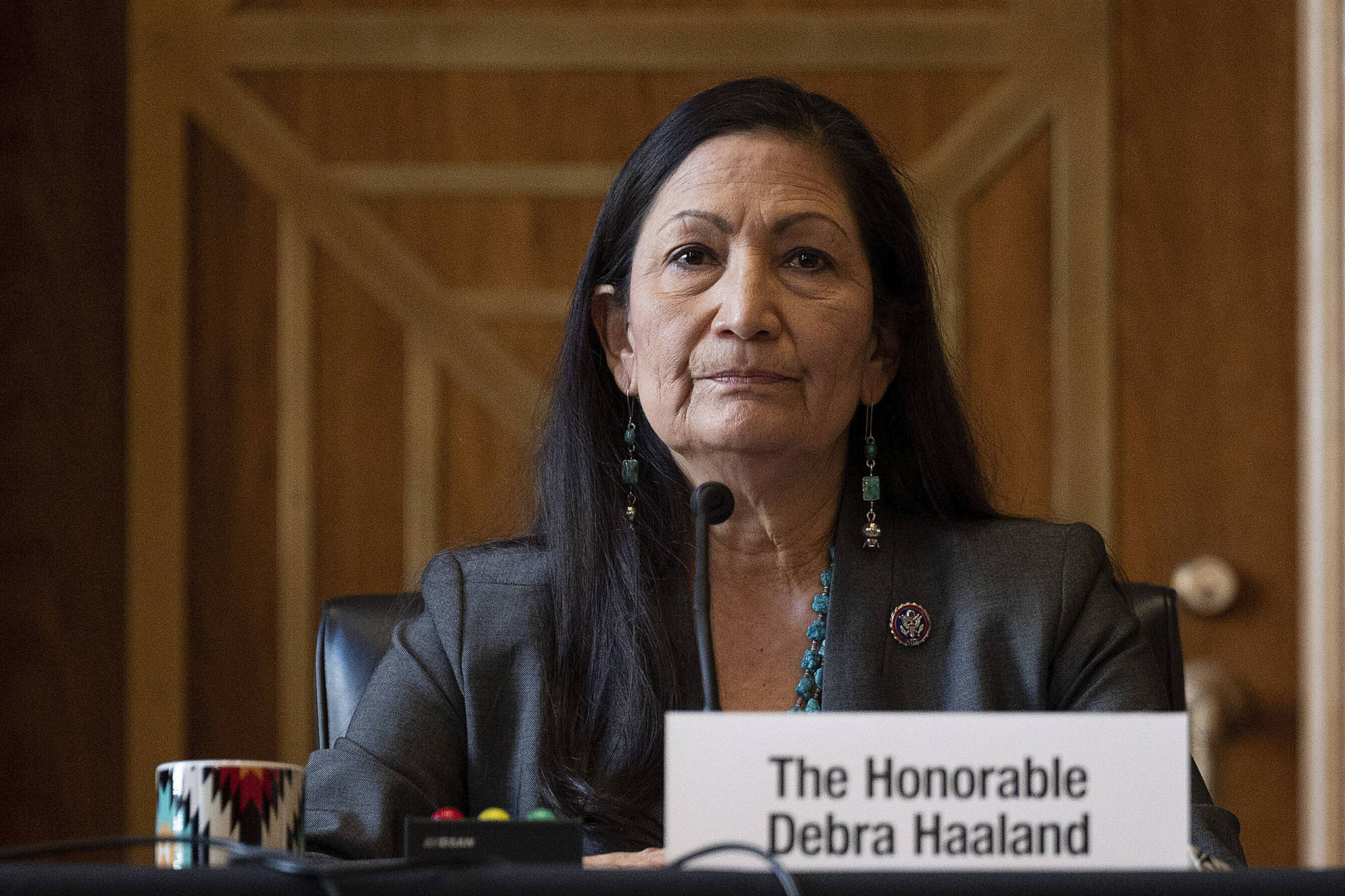 Rep. Deb Haaland, D-N.M., listens during the Senate Committee on Energy and Natural Resources hearing on her nomination to be Interior secretary, on Capitol Hill in Washington. Some Republican senators labeled Haaland “radical” over her calls to reduce dependence on fossil fuels and address climate change, and said that could hurt rural America and major oil and gas-producing states. The label of Haaland as a “radical” by Republican lawmakers is getting pushback from Native Americans. (Jim Watson / Pool Photo)