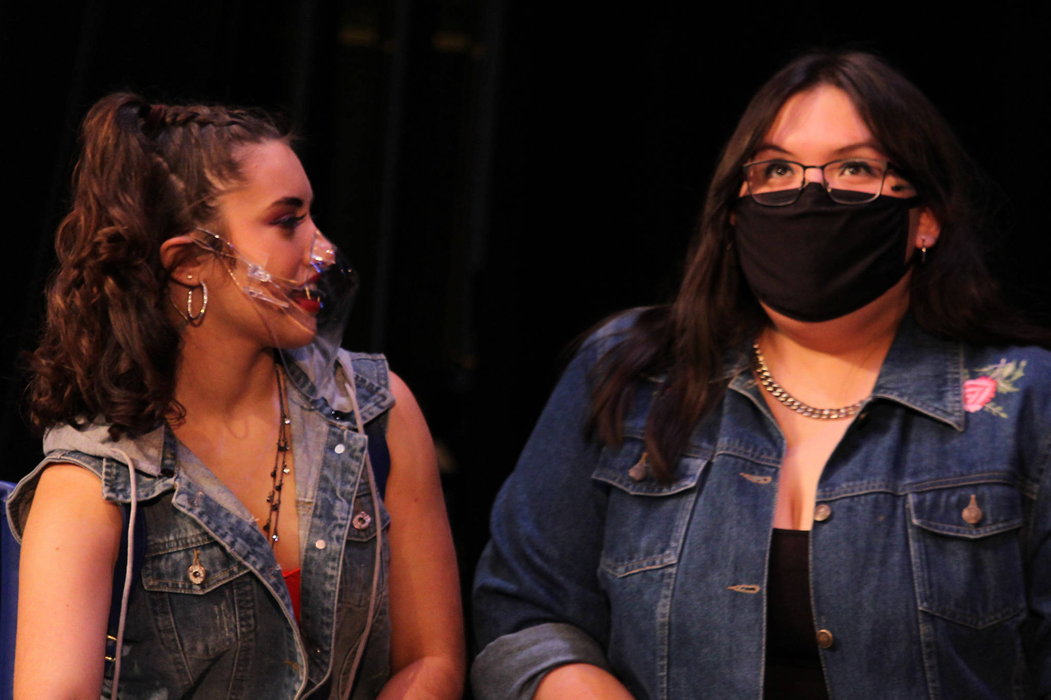Clara Smith talks to Jaylynn Martin in a scene during rehearsal for “Fame: The Musical.” Masks are part of the mitigation measures the production adopted in light of the pandemic. Additionally, the show, which opens Friday evening, will be livestreamed instead of performed in front of a full auditorium. (Ben Hohenstatt / Juneau Empire)