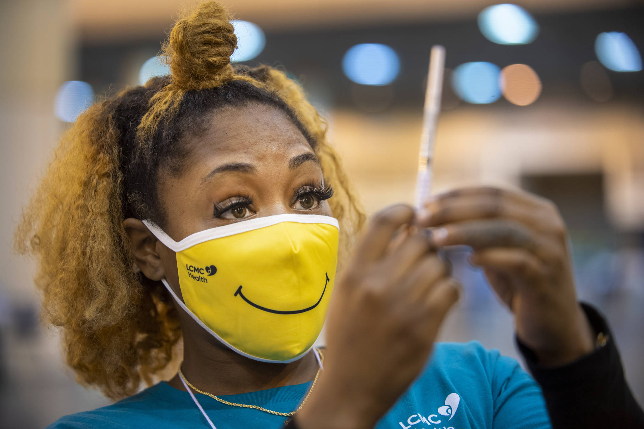 Medical Assistant Keona Shepard holds up the Johnson & Johnson COVID-19 vaccine as she prepares to administer it at the New Orleans Ernest N. Morial Convention Center during the mass coronavirus vaccination in New Orleans, in this Thursday, March 4, 2021, file photo. (Chris Granger / The Advocate)