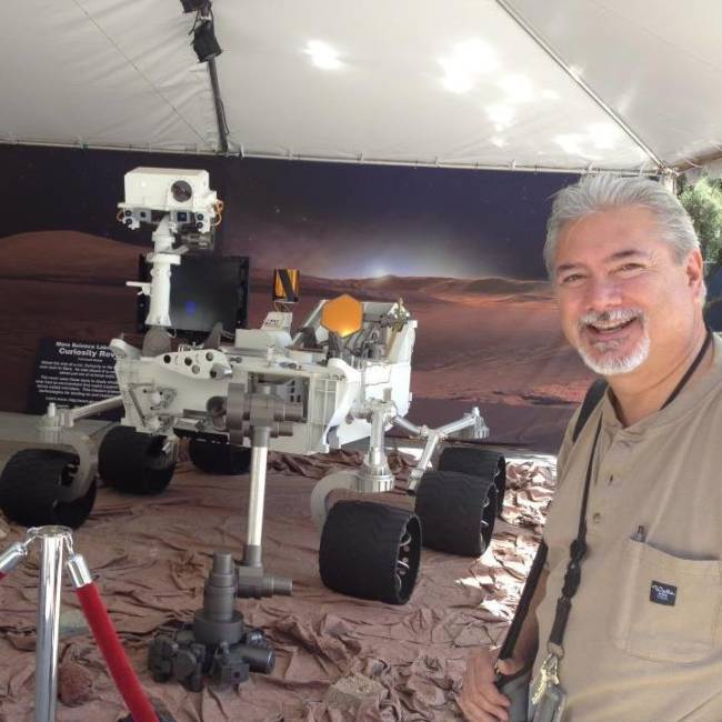 Steven Scott McClure stands with Mars rover Curiosity. (Courtesy Photo / Steven Scott McClure)