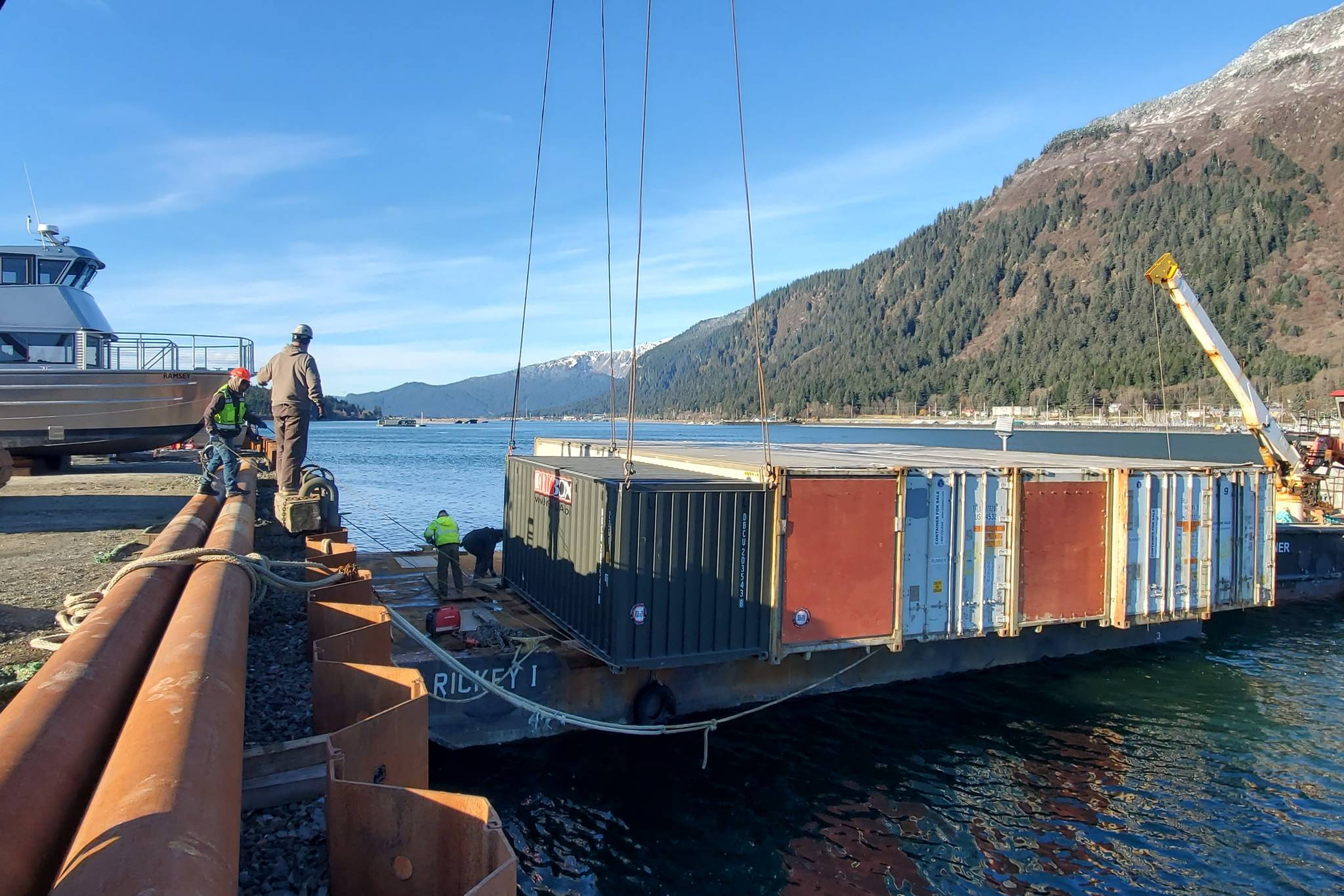 Courtesy photo / Central Council of the Tlingit and Haida Indian Tribes of Alaska
The Biden administration says it wants to strengthen ties with tribal governments like Central Council of Tlingit & Haida Indian Tribes of Alaska, whose workers are seen here loading shipping containers full of supplies bound for needy communities in Southeast Alaska onto a barge in the Gastineau Channel on Oct. 21, 2020.