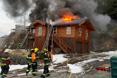 Capital City Fire/Rescue firefighters seek to extinguish a house fire near Point Lena on March 10, 2021. (Courtesy photo / CCFR)