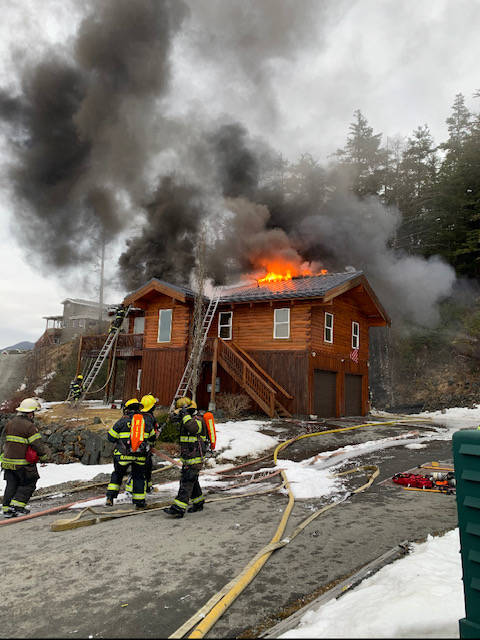 Capital City Fire/Rescue firefighters seek to extinguish a house fire near Point Lena on March 10, 2021. (Courtesy photo / CCFR)