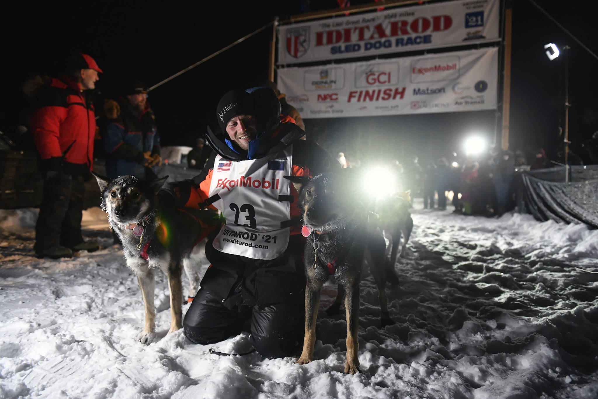 Dallas Seavey poses with his dogs after crossing the finish line to win the Iditarod Trail Sled Dog Race race near Willow, Alaska, early Monday, March 15, 2021. (Marc Lester/Anchorage Daily News, Pool)