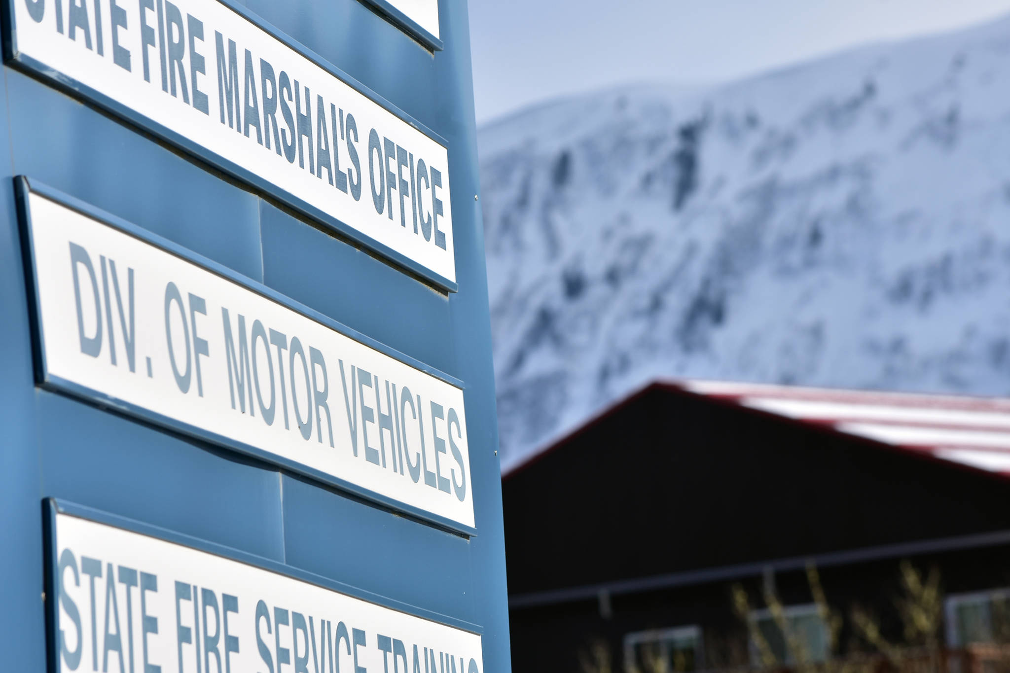 The sign for the Department of Motor Vehicles in Juneau on March 18, 2021. Had a proposal to close six rural DMVs gone through, Juneau woud be the closest DMV for residents in Haines, who aren't able to drive there. (Peter Segall / Juneau Empire)