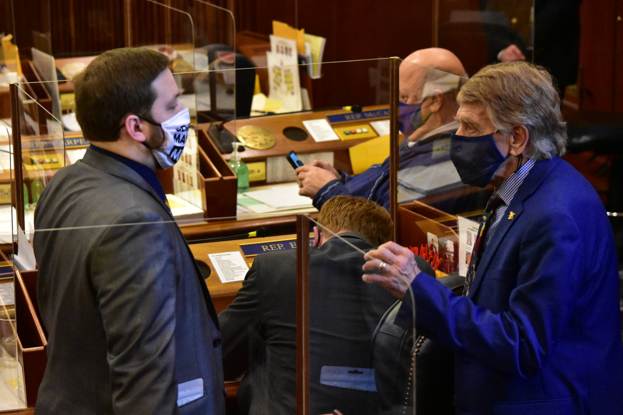 House Minority Whip Rep. Laddie Shaw, R-Anchorage, speaks to Rep. Chris Kurka, R-Wasilla on Friday, March 19, 2021. (Peter Segall / Juneau Empire)