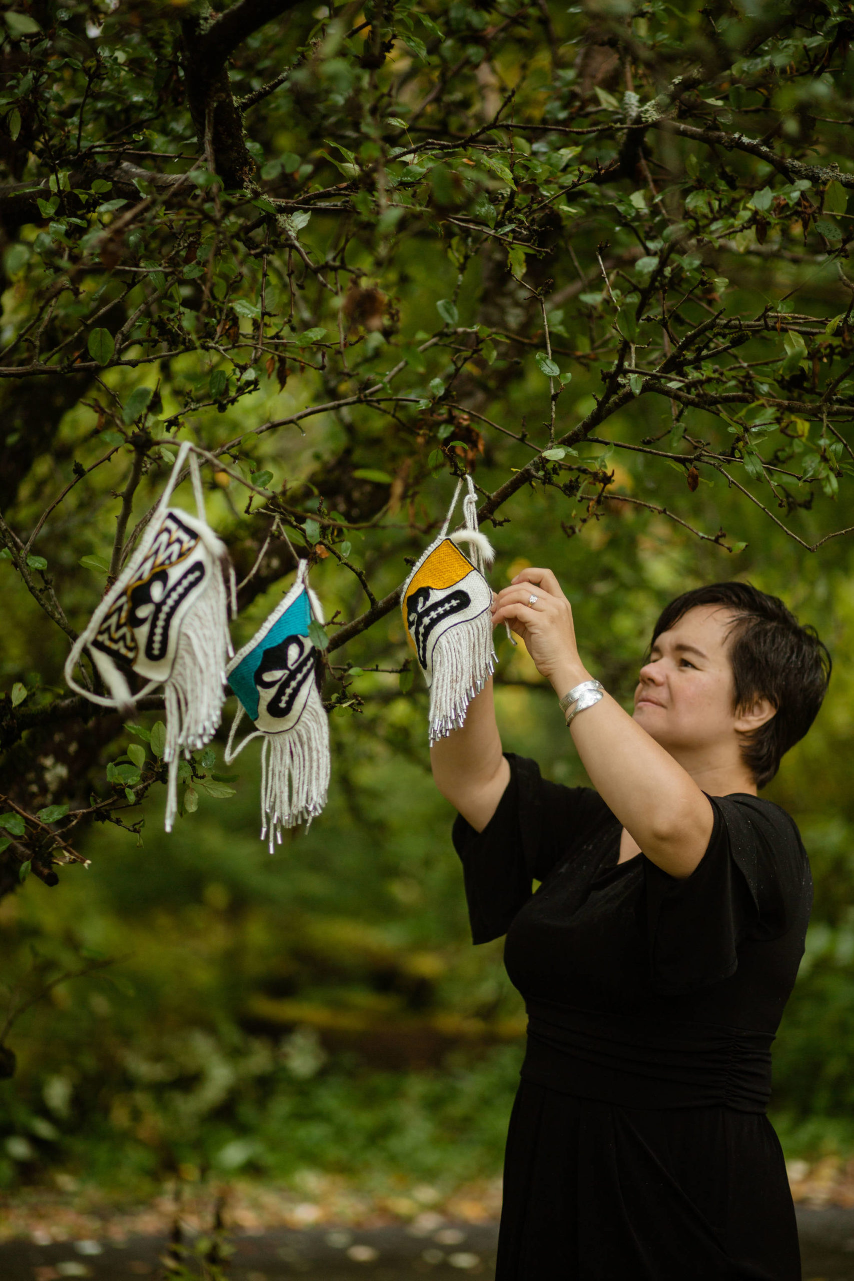 Traditional artist Lily Hope, shown here is recognized as this edition of Tidal Echoes’ featured artist for her work in Ravenstail and Chilkat weaving, particularly her Chilkat Protector masks, shown here hanging.
Courtesy photo / @SydneyAkagiPhotography