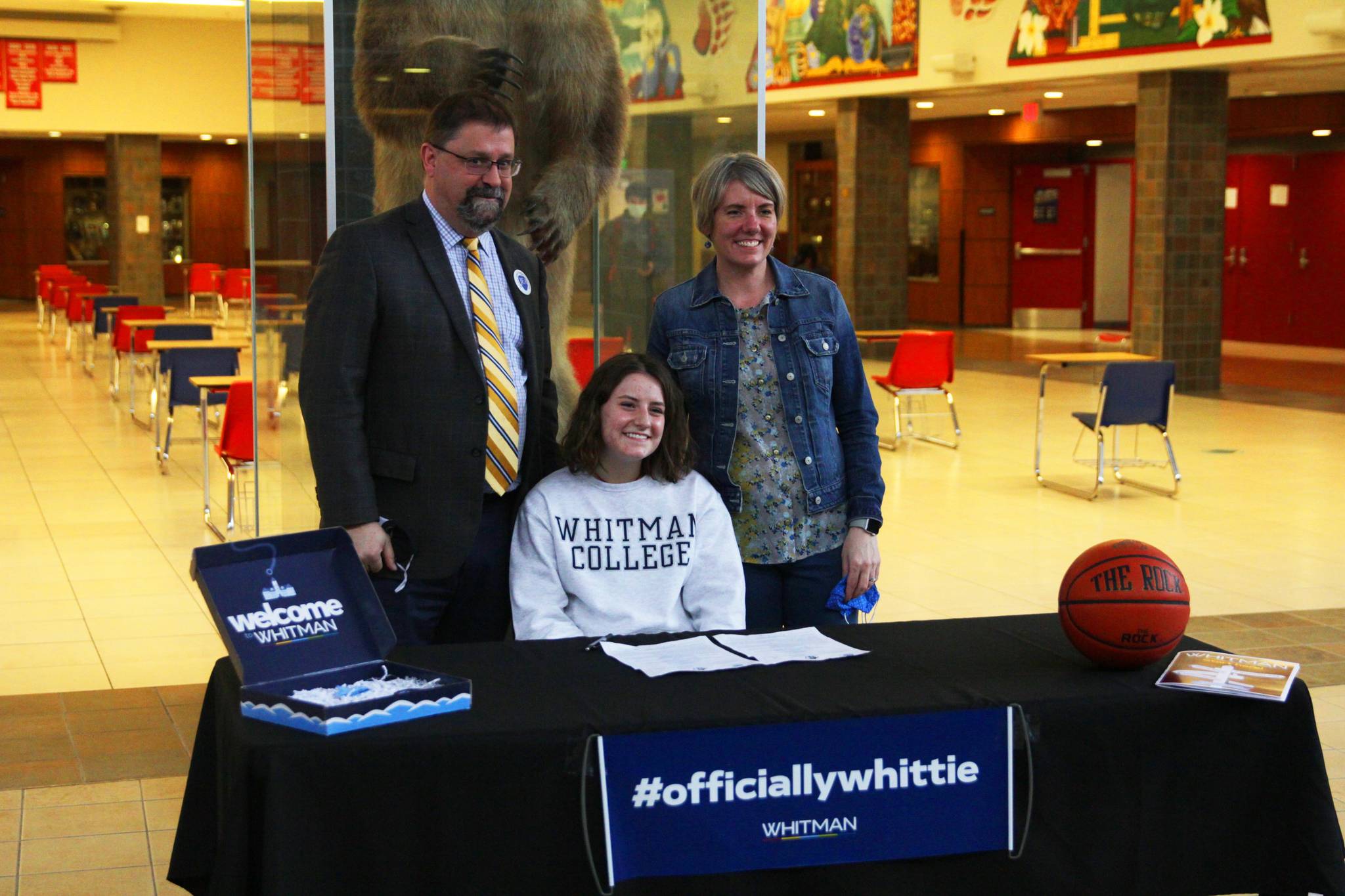 Juneau-Douglas High School: Yadaa.at Kalé senior Kiana Potter, seen here with her parents, committed to playing basketball for Whitman College in Washington on April 8, 2021. (Michael S. Lockett / Juneau Empire)