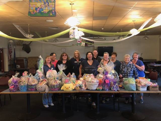 Women of the Moose volunteers pose with the Easter Baskets that they put together for the children at the AWARE shelter. Each basket was made specific to each child’s age, said Jaime Isaak in an email. “A lot of happy children,” Isaak said. (Courtesy Photo / Jaime Isaak)