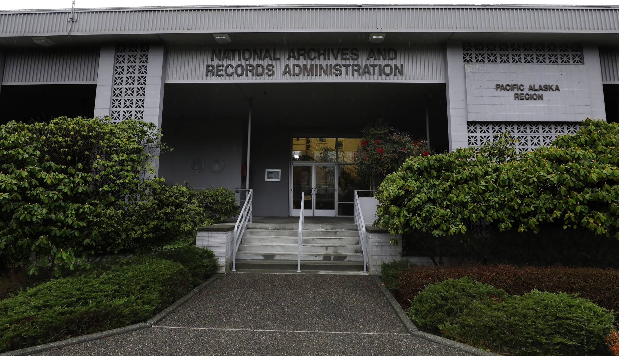 This photo shows the National Archives in the Sand Point neighborhood of Seattle that has about a million boxes of generally unique, original source documents and public records. In an announcement made Thursday, April 8, 2021, the Biden administration has halted the sale of the federal archives building in Seattle, following months of opposition from people across the Pacific Northwest and a lawsuit by the Washington Attorney General’s Office. Among the records at the center are tribal, military, land, court, tax and census documents. (Alan Berner / The Seattle Times)