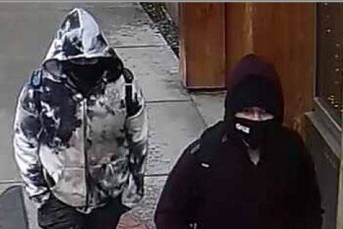 The Juneau Police Department is searching for a man and woman, pictured here in surveillance footage, wanted in connection for a robbery that occurred downtown on April 1, 2021. (Courtesy photo / JPD)