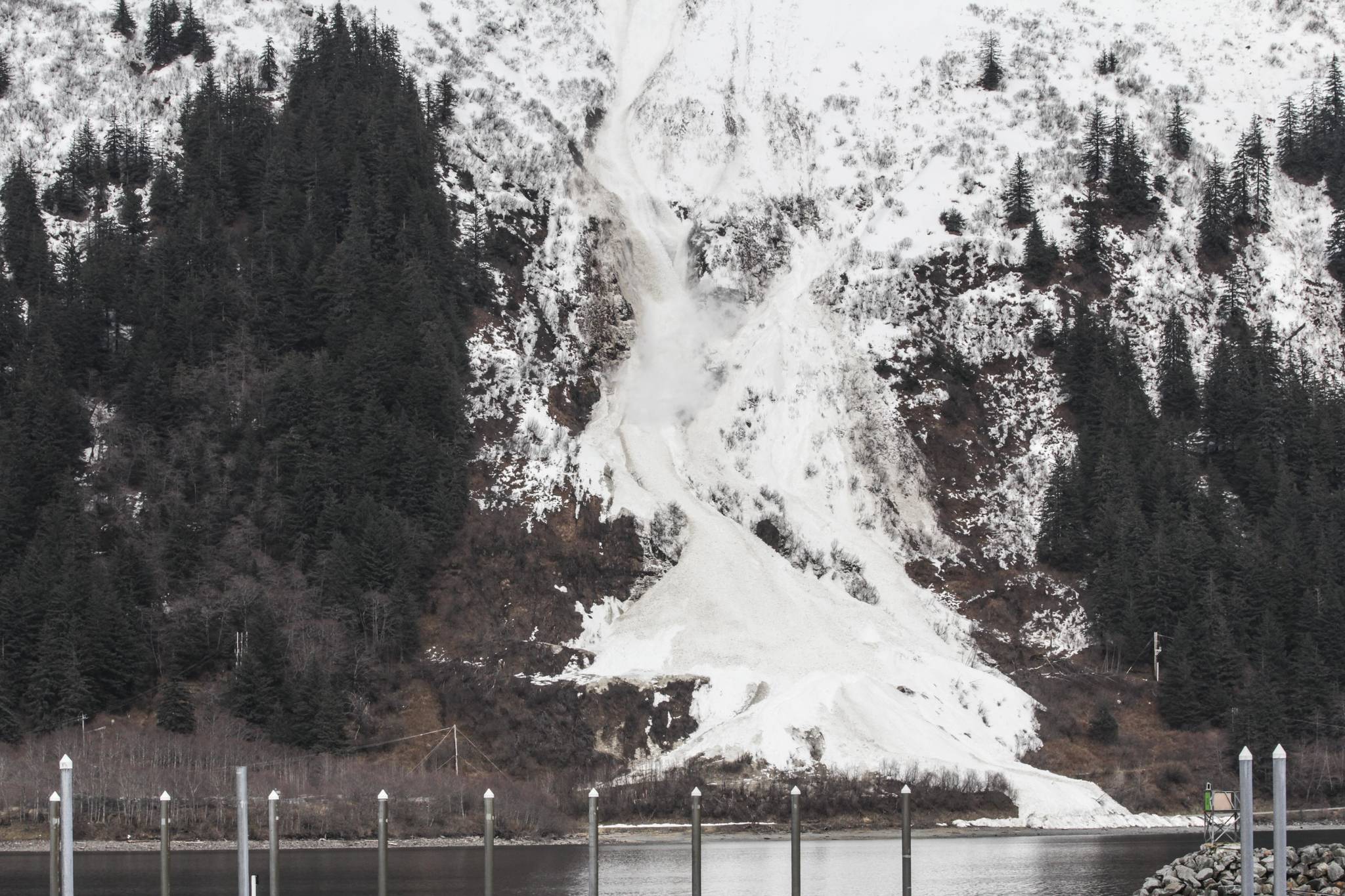 Michael S. Lockett / Juneau Empire 
The Alaska Department of Transportation and Public Facilities triggered an avalanche as a mitigation measure above Thane Road on April 15, 2021.