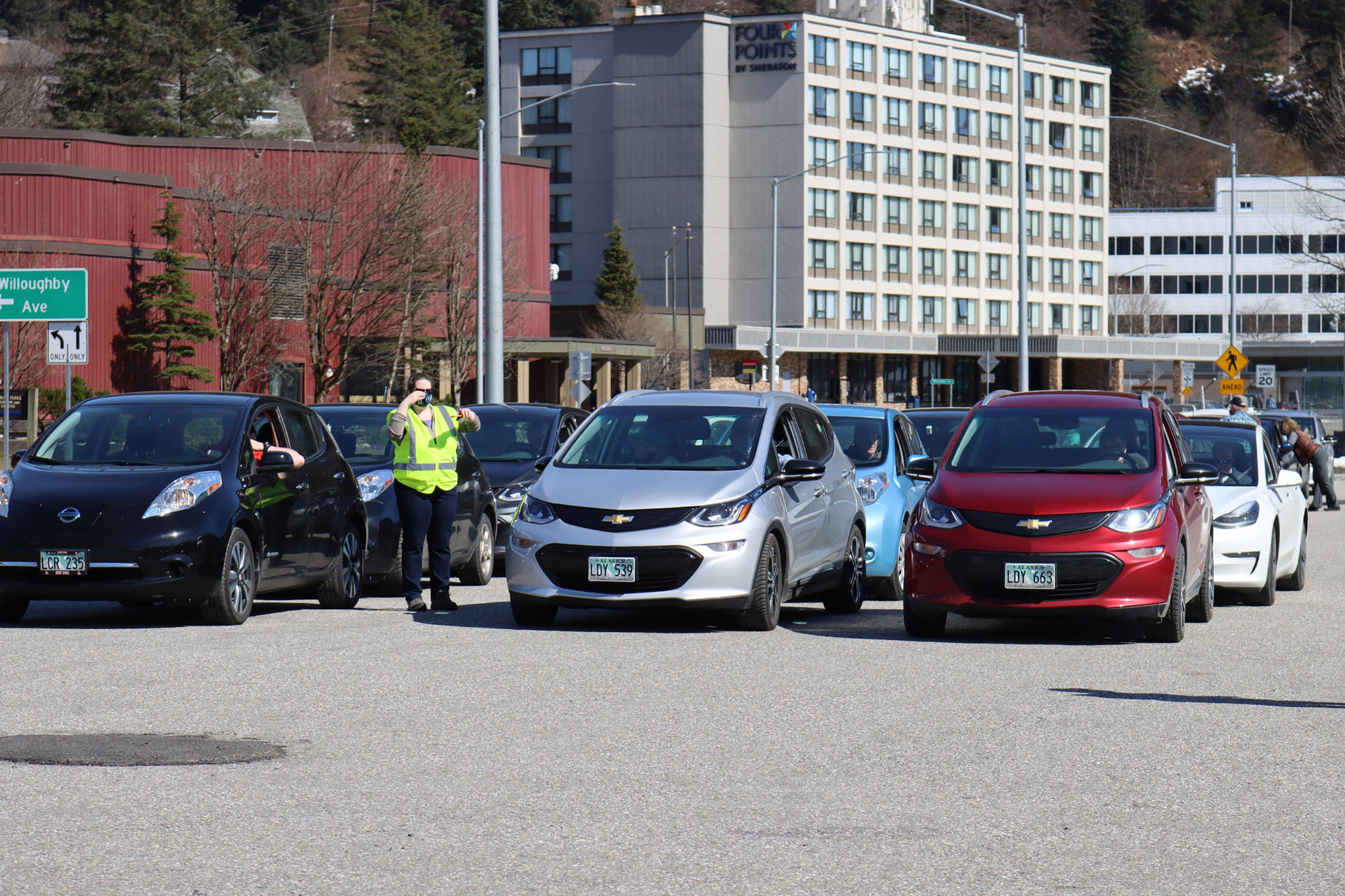 An array of electric vehicles wait to beging the Earth Day Electric Vehicle Road Rally held on Saturday, April 17. (Ben Hohenstatt / Juneau Empire)